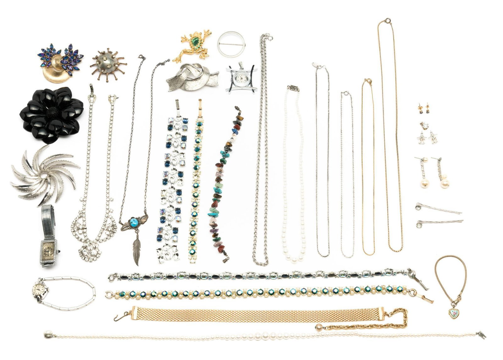 31 Pcs Costume Jewlery: Includes necklaces, brooches, earrings, bracelets, and more. Necklaces measure 15" to 23-3/4" long. Bracelets measure 7-3/4" to 8" long. Brooches measure 2" to 2-1/2" wide. Some missing gemstones.