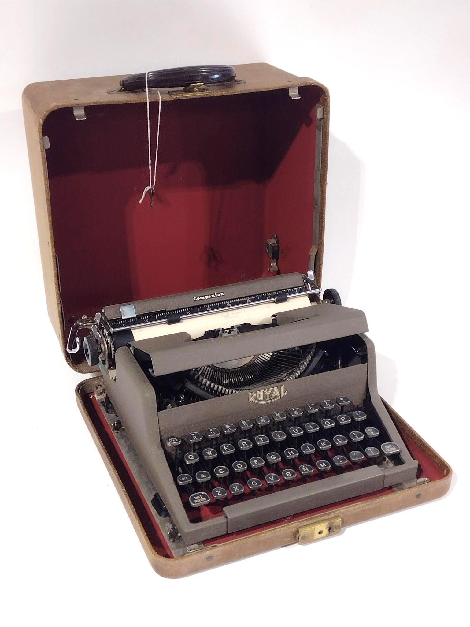 Royal Companion Typewriter: Overall with closed case: 12-3/4" wide x 14" deep x 7" high. Some tears, losses and discoloration.