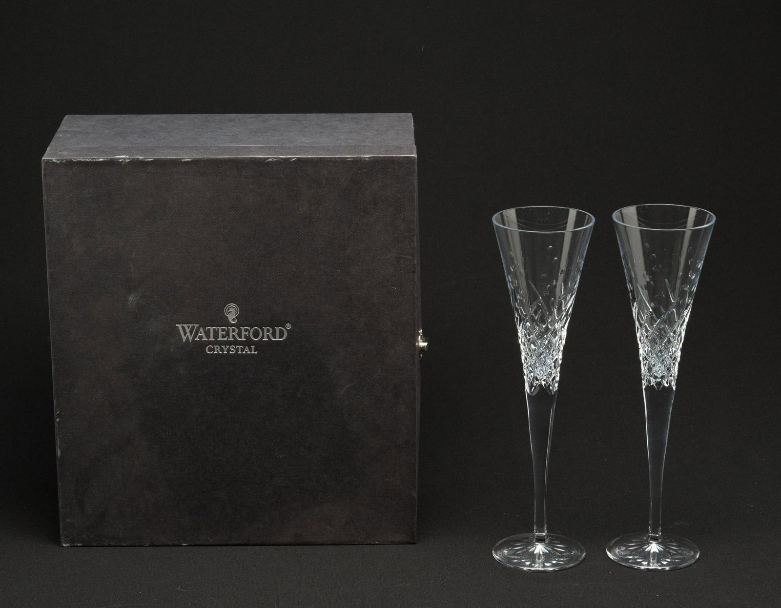 Pair Waterford Wishes Toasting Flutes in OB: Box: 11-1/2" wide x 6" deep x 12-3/4" high. Flutes each 3" diameter x 11" high. Box with some discoloration and scuffing consistent with age and use.