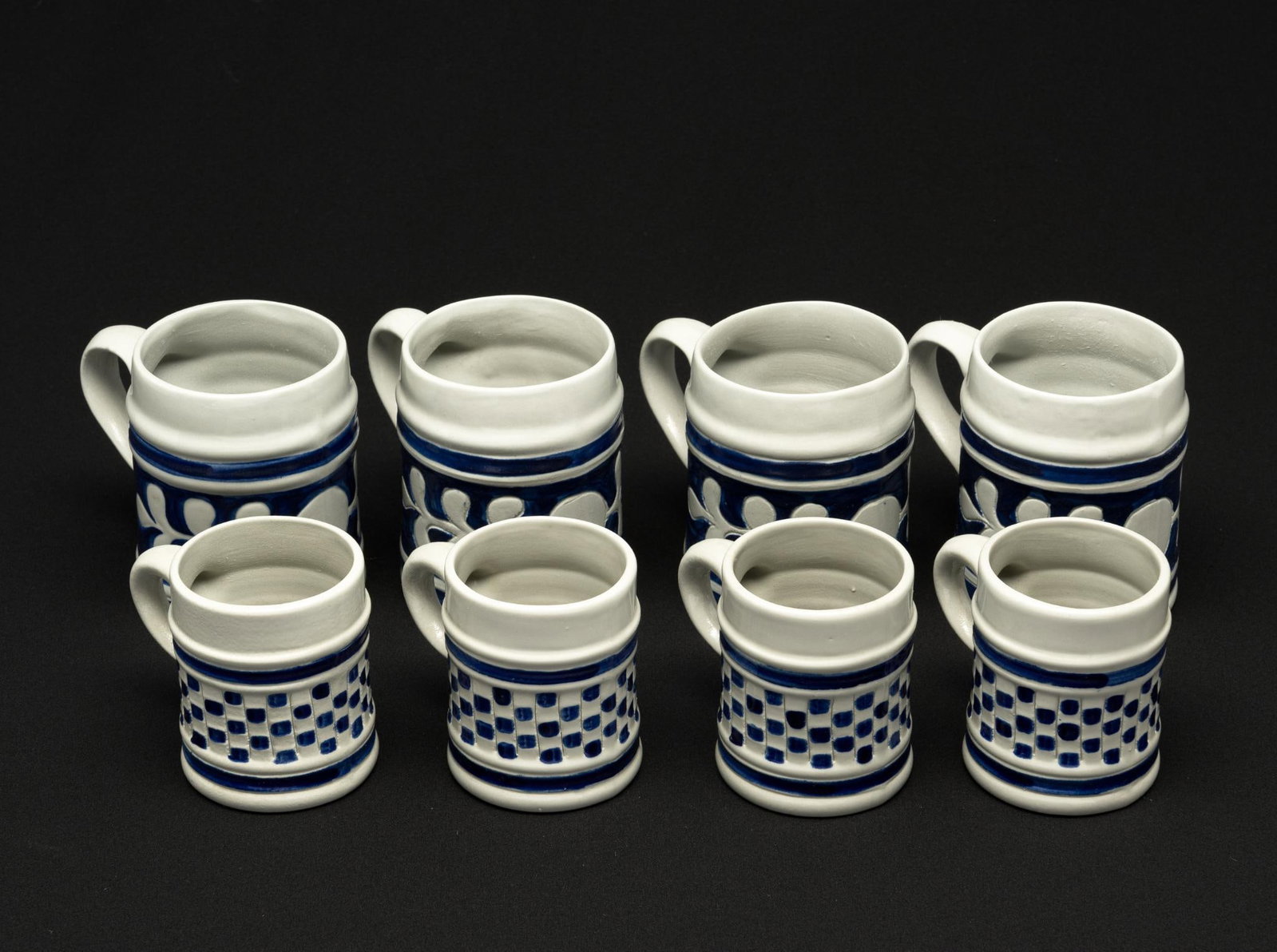 8 Williamsburg Mugs: All marked. 2-3/4" to 3-1/4" wide x 3-1/4" to 4-1/2" high.