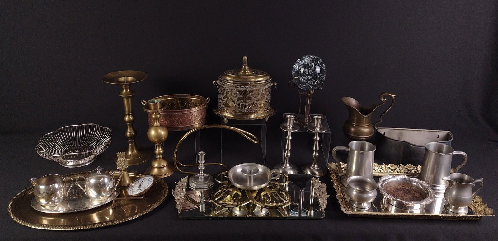 26 Pcs Copperware & Pewter: NOT ELIGIBLE FOR IN-HOUSE SHIPPING. Includes candlesticks, mugs, pitcher, and more. 3" to 5-5/8" wide x 3-1/4" to 11-3/4" high.