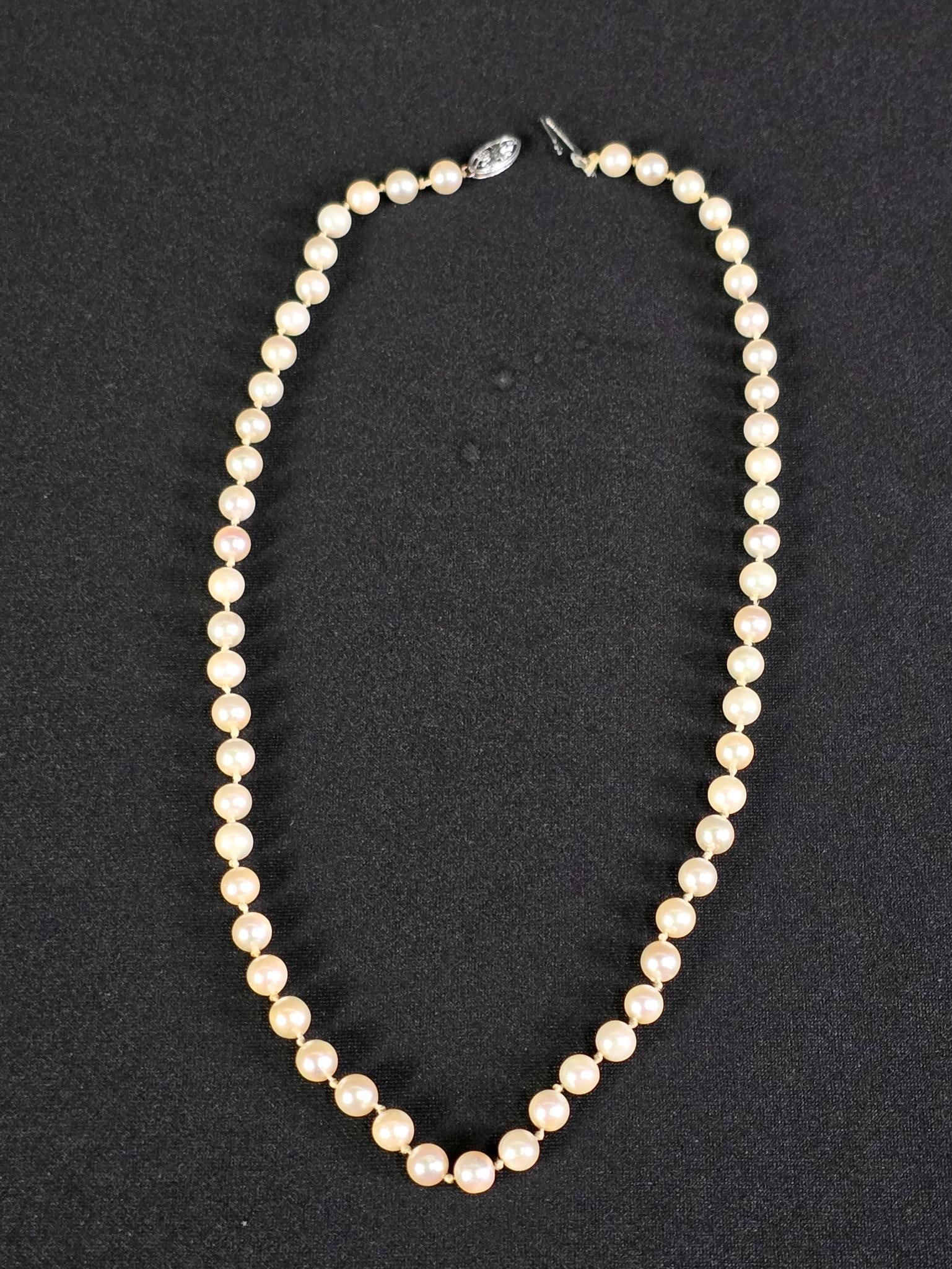 Pearl Necklace w/ 14K Gold Clasp: 16" long. Individually knotted pearls approximately 5.3mm-5.5mm each. Marked 14k white gold clasp. Clasp reattach.