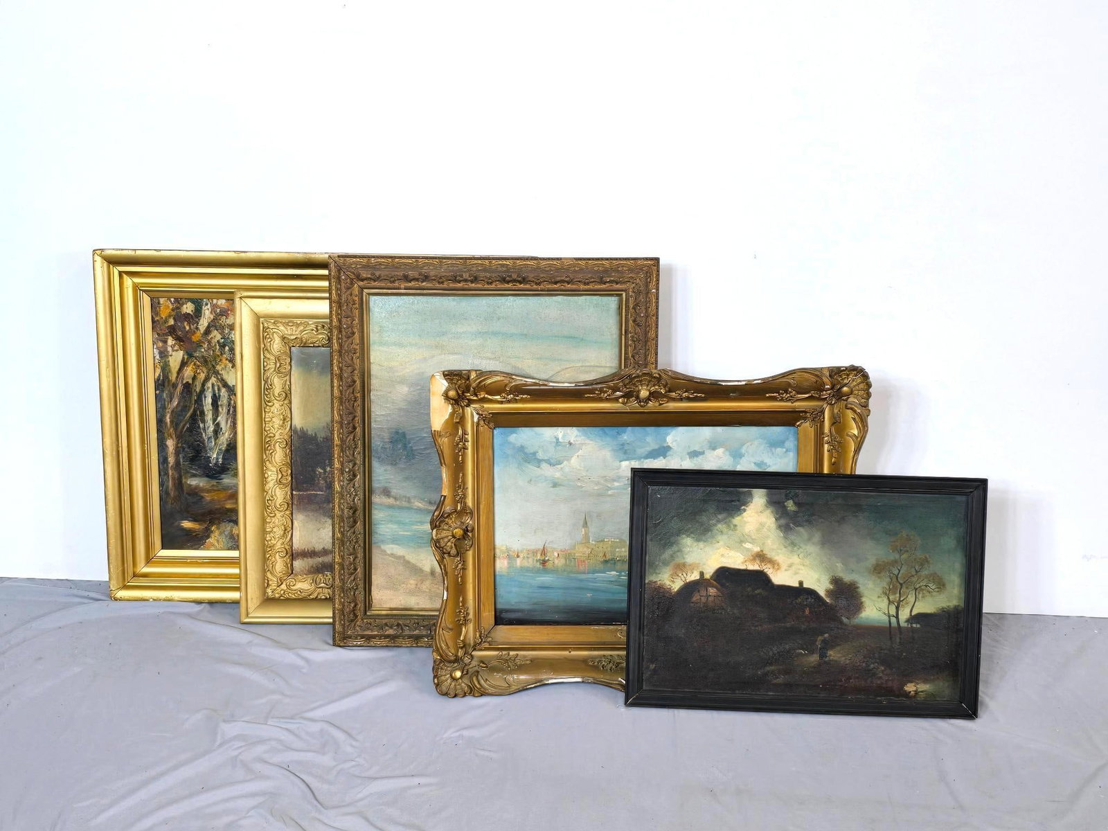 5 Antique Oil Paintings: NOT ELIGIBLE FOR IN-HOUSE SHIPPING. A group of oil on canvas and oil on board antique paintings. The paintings and frames have wear and damage due to age. Framed sizes range from 21 1/2" X 26 3/4" to 