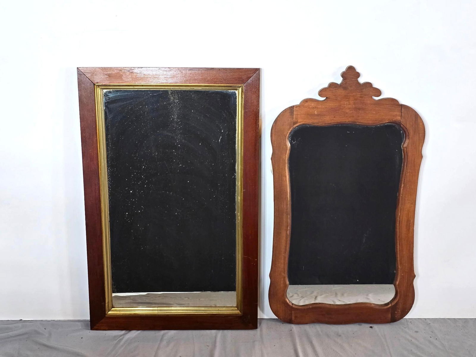 2 Antique Mirrors with Wood Frames: NOT ELIGIBLE FOR IN-HOUSE SHIPPING. Mirrors have some spotting due to age. 30 1/2" X 19 1/2" and 30 1/2" X 17". PROVENANCE: This lot was consigned by the former Double Eagle Antiques on North Second S
