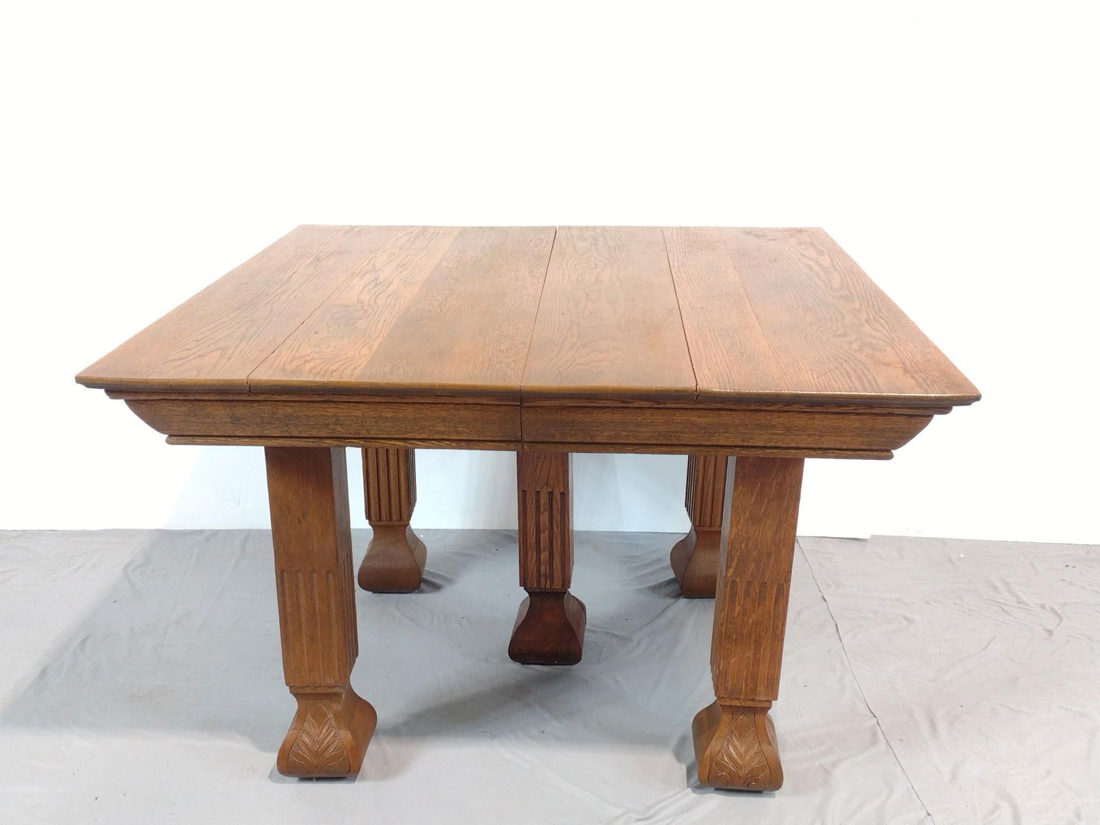 Antique Table: NOT ELIGIBLE FOR IN-HOUSE SHIPPING. 42" wide X 42" deep X 27-3/4" high. Top has splits. Also has some light scratches. PROVENANCE: This lot was consigned by the former Double Eagle Antiques on North S