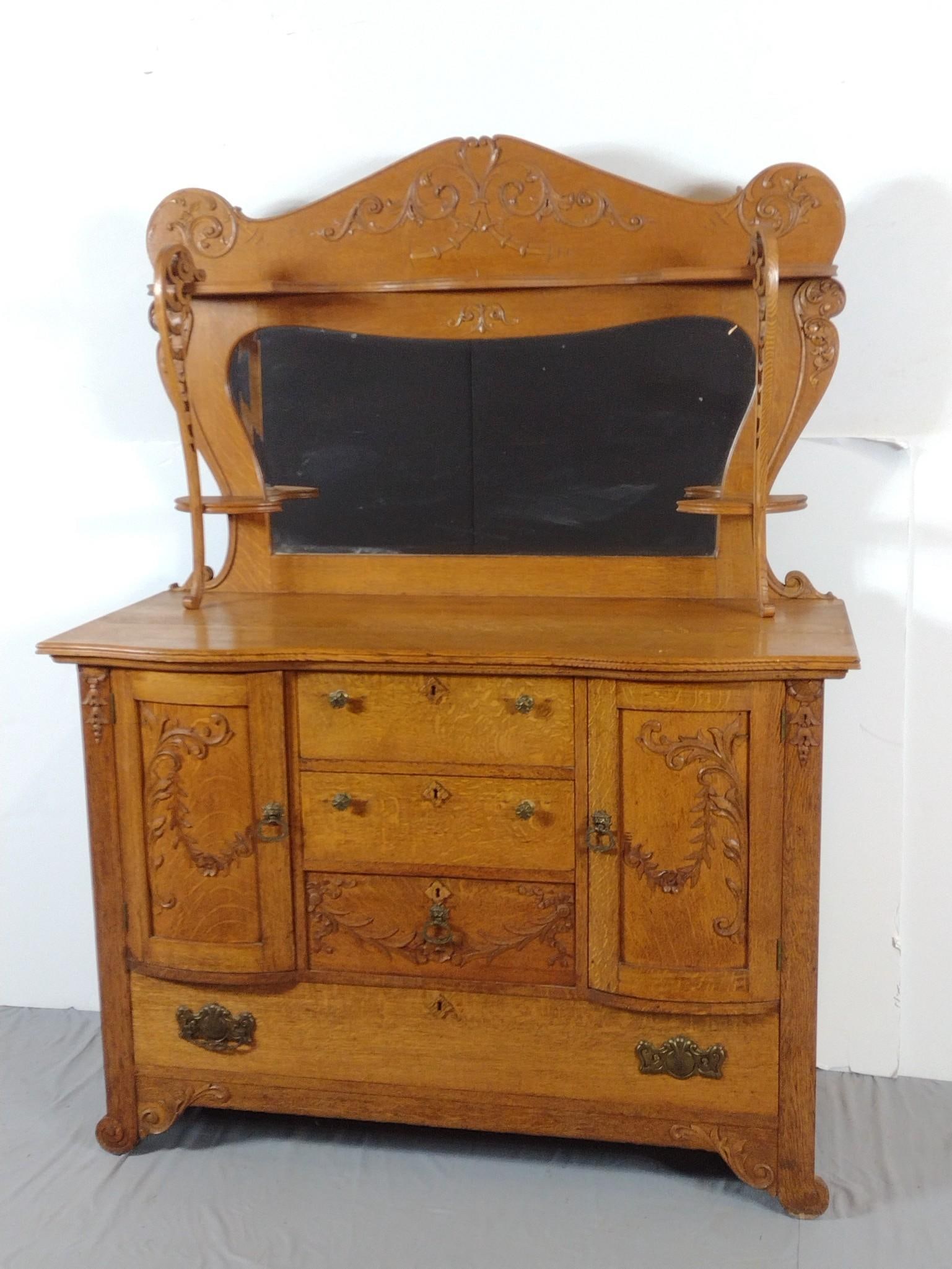 Golden Oak Sideboard: NOT ELIGIBLE FOR IN-HOUSE SHIPPING. 52" wide X 23" deep X 71" high. Has wear consistent with age. PROVENANCE: This lot was consigned by the former Double Eagle Antiques on North Second Street in Harri