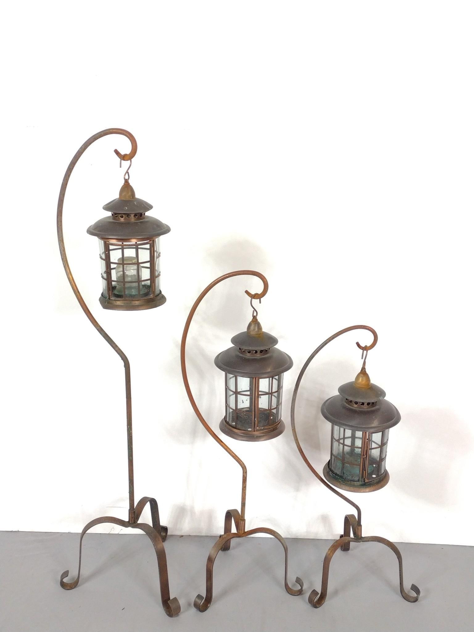 Set Of Three Garden Lanterns: NOT ELIGIBLE FOR IN-HOUSE SHIPPING. Small 12" wide X 12" deep X 30" high. Large 14" wide X 14" deep X 48-1/2" high. All have some rust.