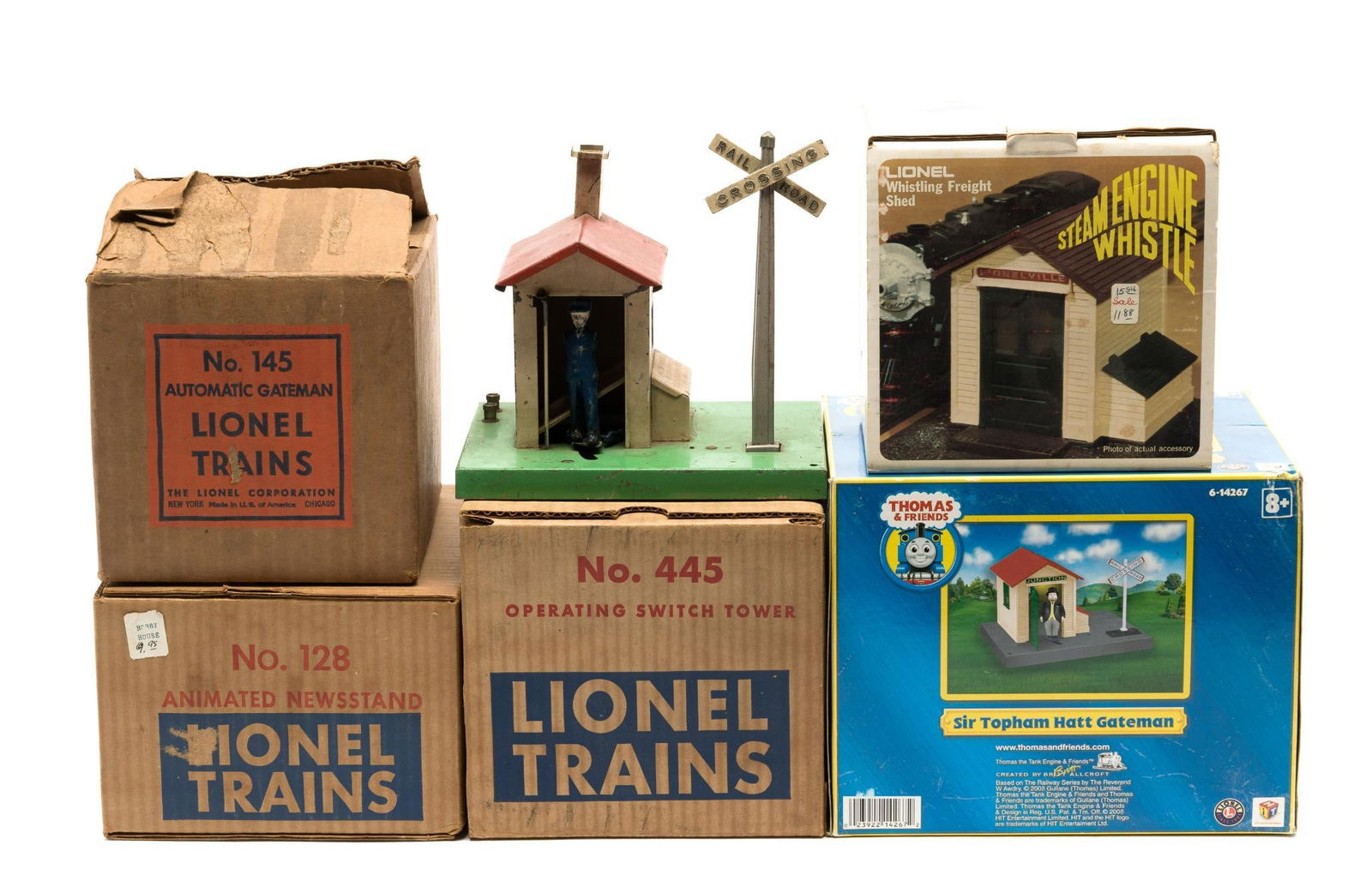 (6) Lionel O-Gauge Track Accessory Buildings: DESCRIPTION: Includes Thomas & Friends Gateman, Newstand, Freight SHed, and more. CONDITION: Most with original boxes, and appear in generally good condition. MEASUREMENTS: ~7" x 9" generally.