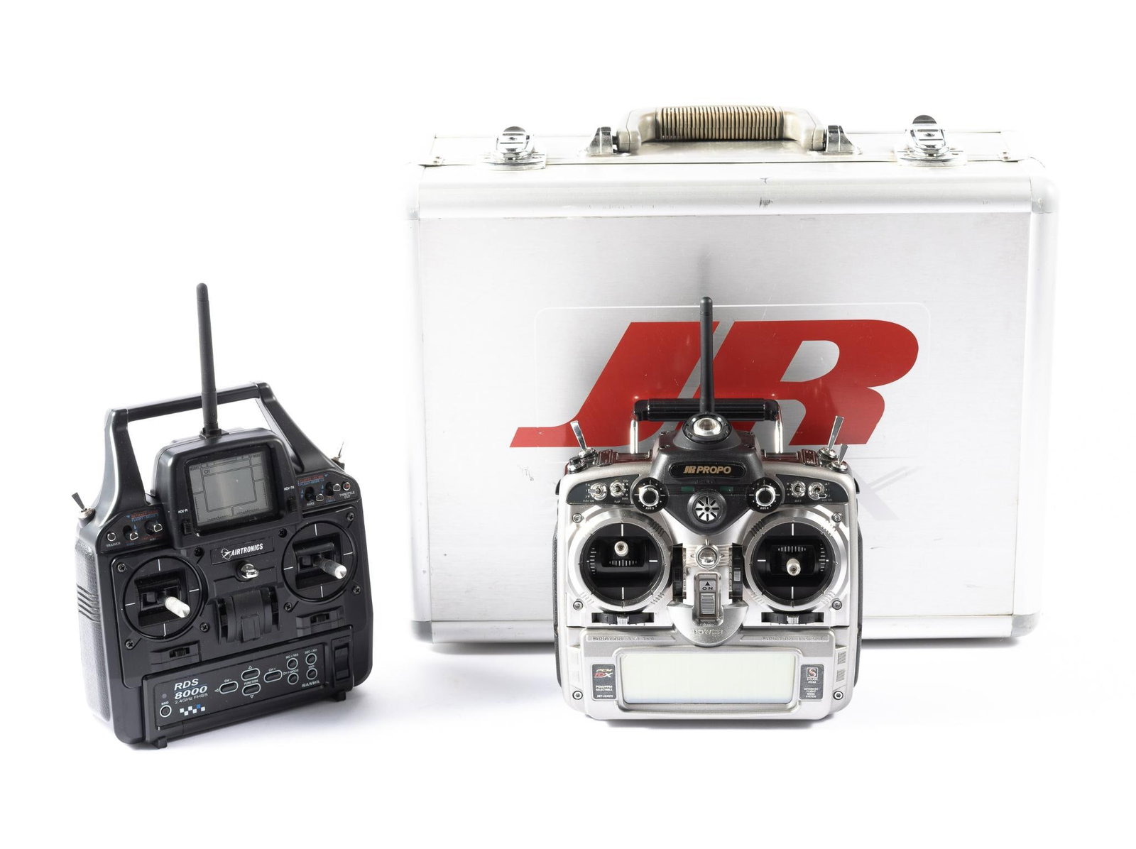 2 2.4 GHz Transmitters: NOT ELIGIBLE FOR IN-HOUSE SHIPPING. DESCRIPTION: Includes Airtronics RDS 8000 and Pilot JP Propo PCM 10X. CONDITION: Not tested.