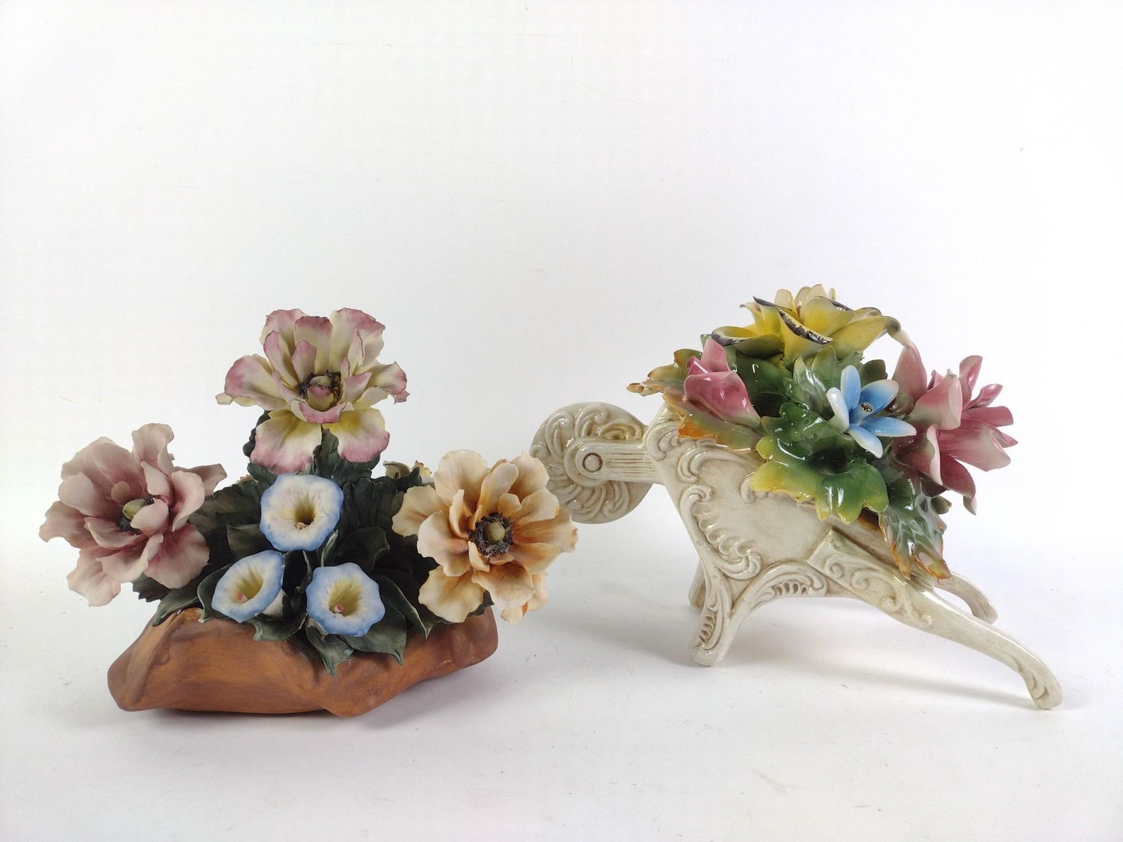 2 Capodimonte Italian Porcelain Flowers: A few minor chips. 8-1/4" to 8-1/2" height x 10-1/2" to 12" width.