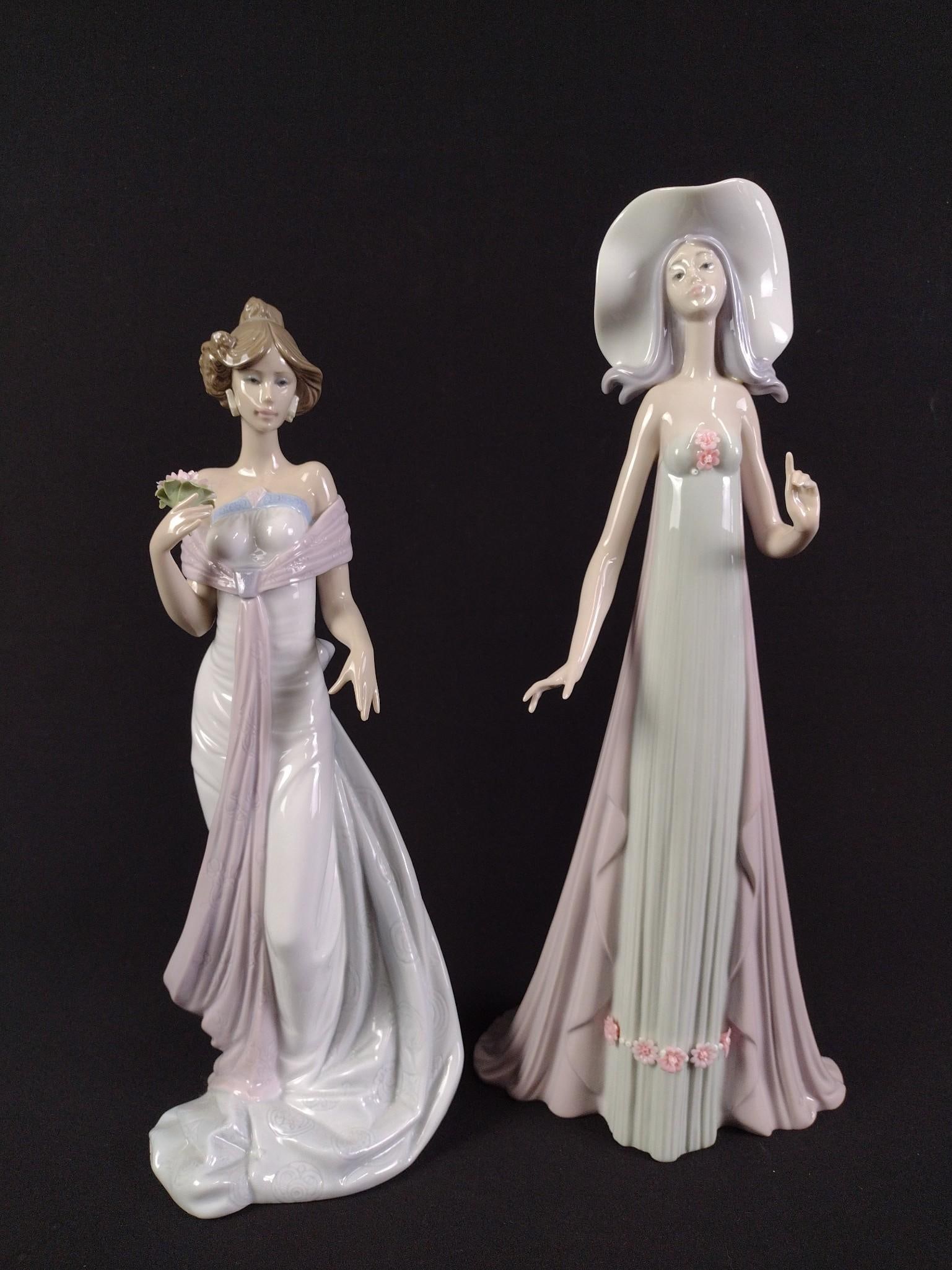 2 Lladro Figurines: Summer Infatuation and The Debutante. 13-1/4" to 13-3/4" height. 4-1/2" to 6" width.