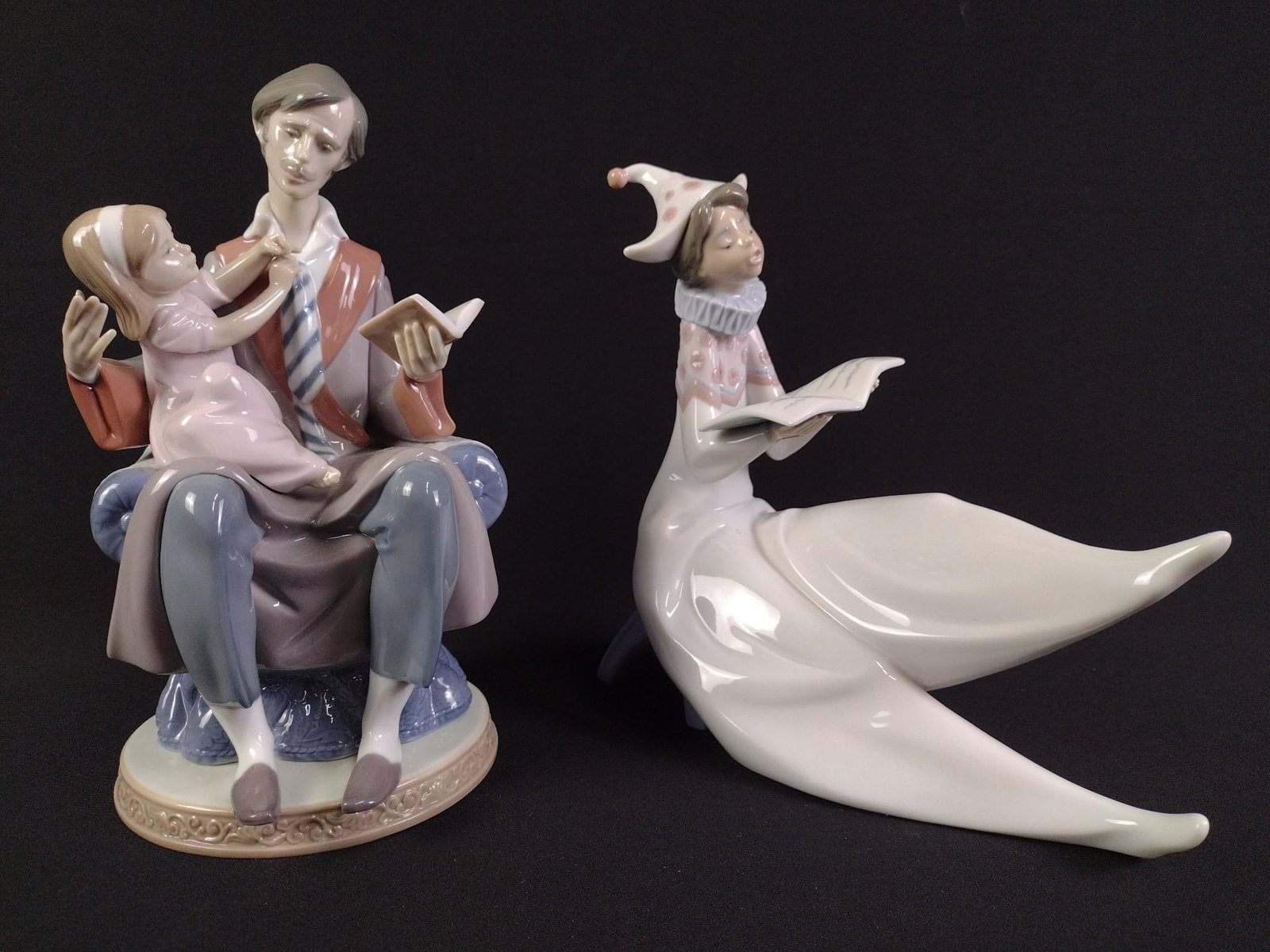 2 Lladro Figurines: Includes Young Jester Singer and Daddy's Girl. 7-3/4" to 8-3/4" height. 5" to 8" width.