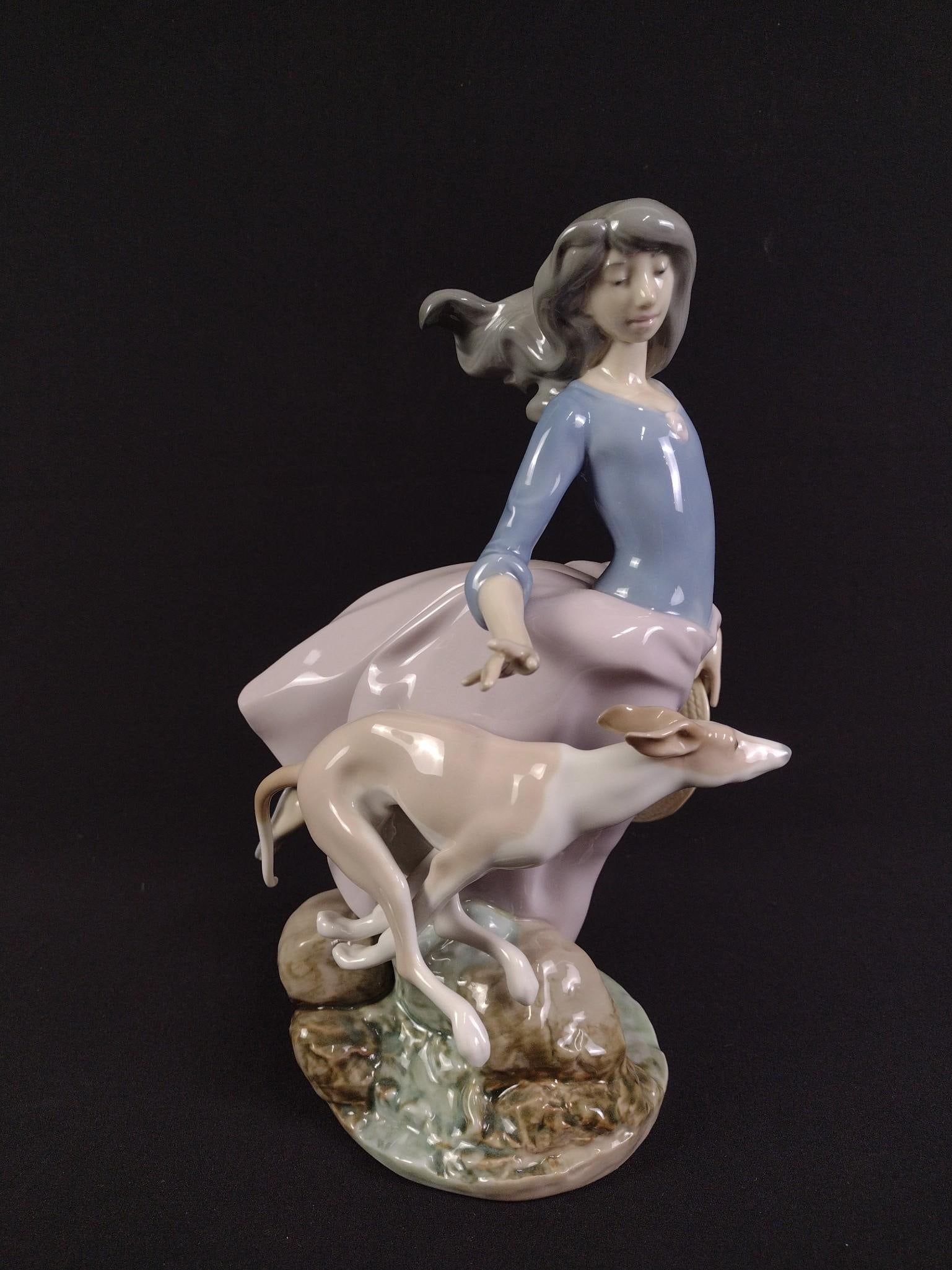 Lladro Afternoon Jaunt Figurine: 10-1/2" height x 7-1/2" width.