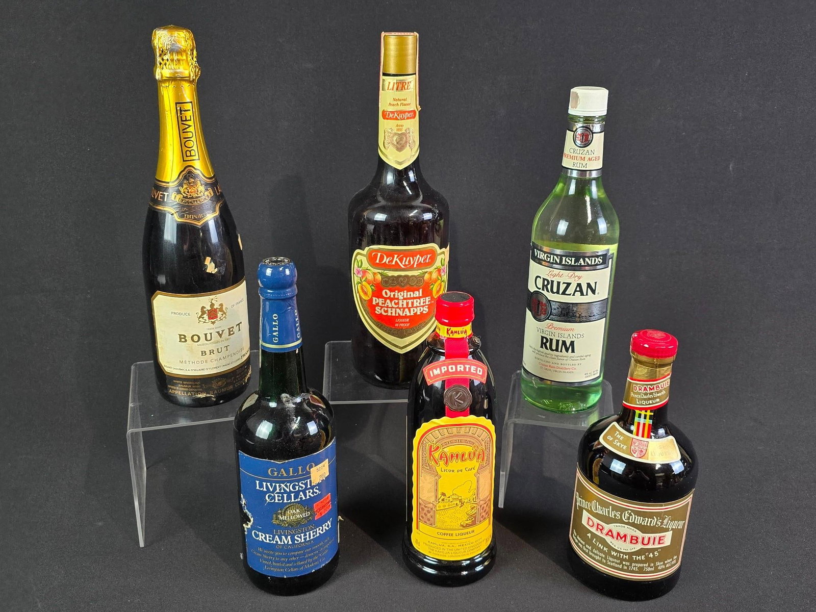 6 Bottles Estate Alcohol incl Drambuie: Also includes Light-Dry Rum, Peachtree Snapps, Bouvet champagne, Livingston Cream Sherry, and Kahlua.