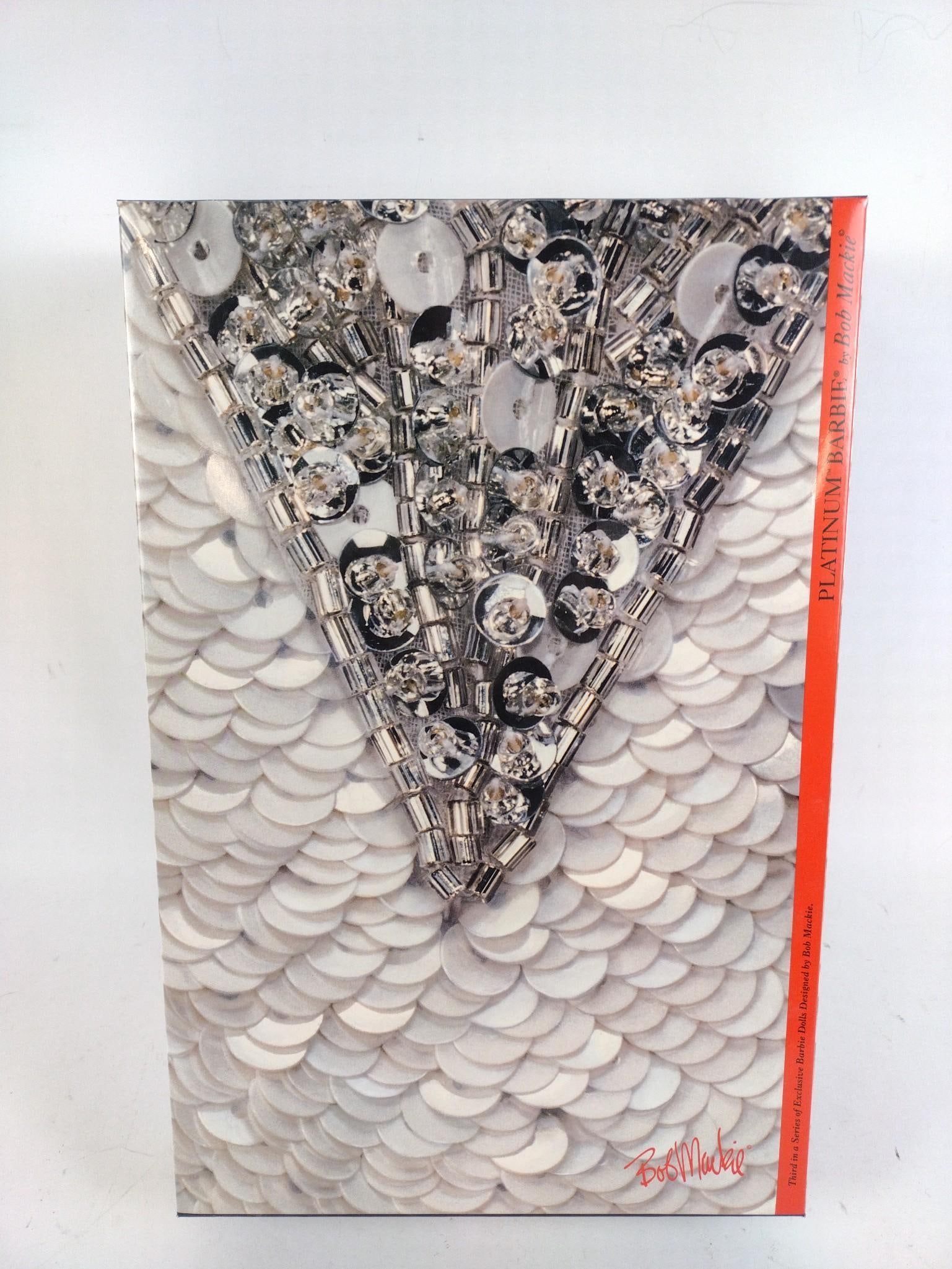 Bob Mackie Platinum Barbie in OB: New in open box. Barbie has not been removed from original foam case. Shipping box included.