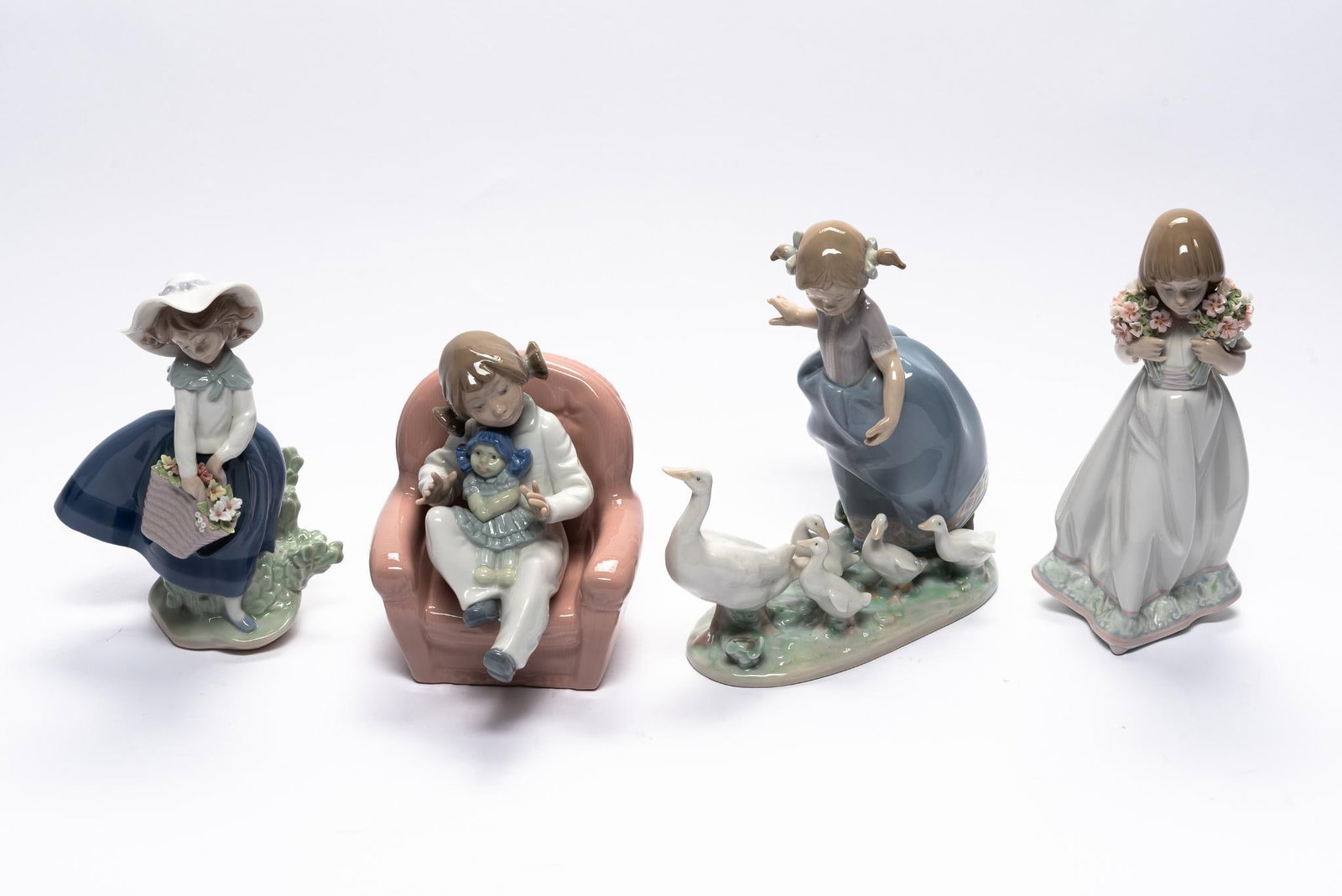 4 Lladro Figurines: Includes little girls. 5-1/4" to 8" high.