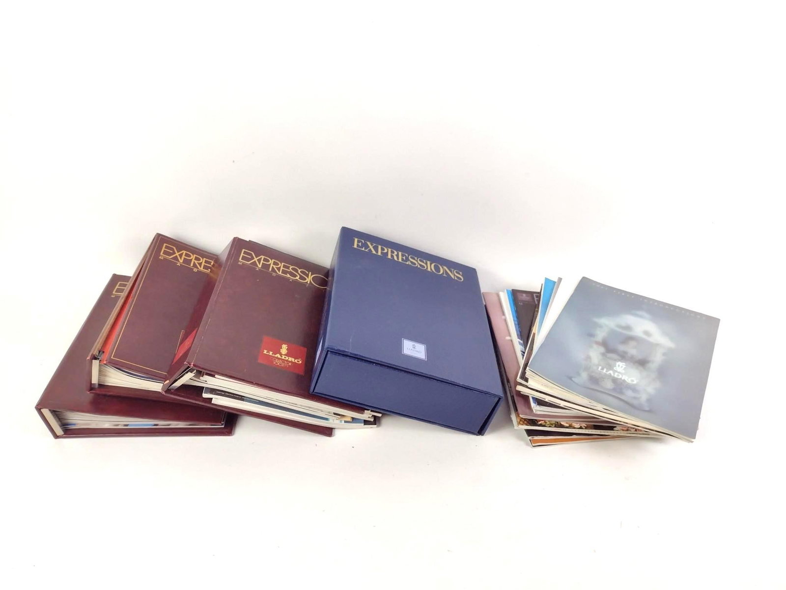 Lot of Lladro Publications incl. Expressions Magazine: NOT ELIGIBLE FOR IN-HOUSE SHIPPING. Also includes First Introductions booklets, and more.