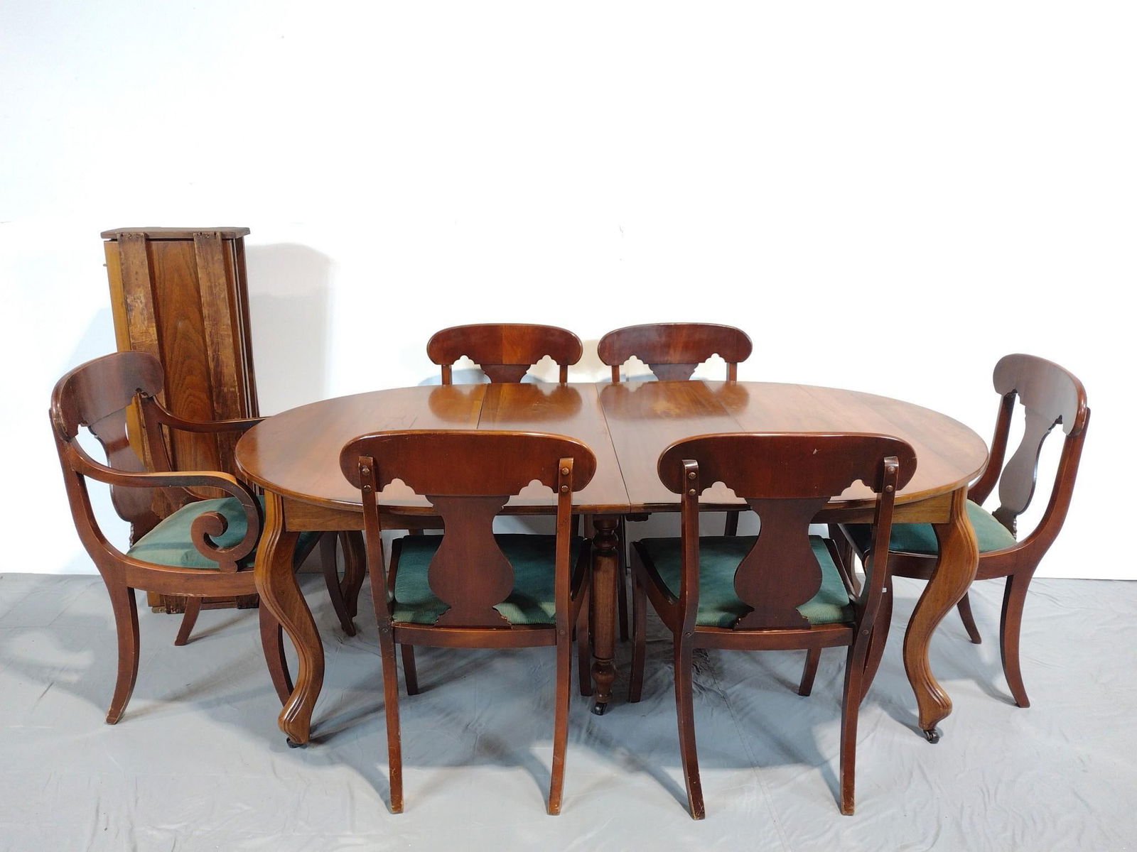 Dining Room Table & Chair Set: NOT ELIGIBLE FOR IN-HOUSE SHIPPING. Table 46" wide X 45-1/2" deep X 28-1/4" high. 6 Table leaves each 14" wide. Chairs 20-1/2" wide X 20" deep X 35" high. All have some light scratches.