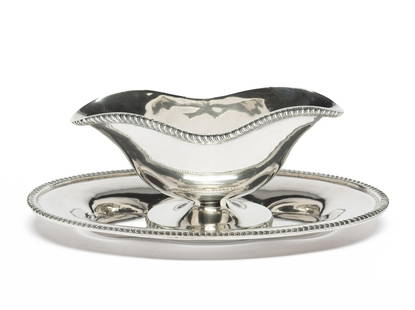 Mexican Sterling Silver Gravy Boat & Underplate: DESCRIPTION: Both pieces stamped Sterling Heather Mexico. MEASUREMENT: 3 3/4" height x 10 1/4" length. 26.6 troy ounces. CONDITION: Light scratches from use.