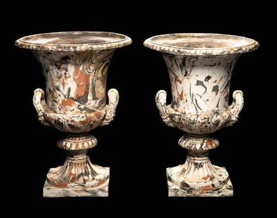 Pair of Ceramic Urns: NOT ELIGIBLE FOR IN-HOUSE SHIPPING. DESCRIPTION: Pair of ceramic with polychrome marbleized glaze. Circa 19th century. MEASUREMENT: 15" wide x 20" high. CONDITION: One of the urns is loose between the