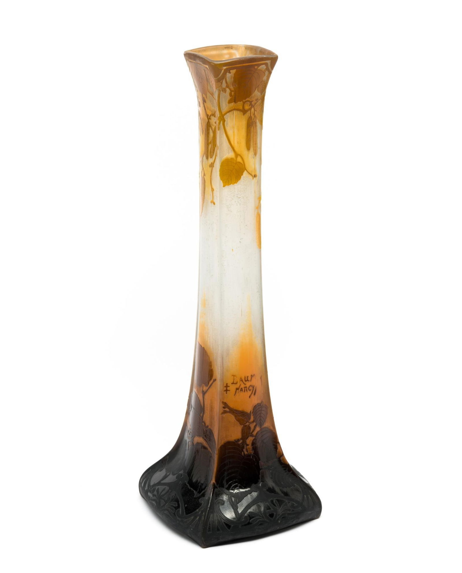 Daum Nancy Tall Cameo Glass Vase: NOT ELIGIBLE FOR IN-HOUSE SHIPPING. DESCRIPTION: A unique piece with cushion-square cross section. Foliage patterns and orange hues. MEASUREMENT: Height is 20 1/2". CONDITION: No chips or repairs.