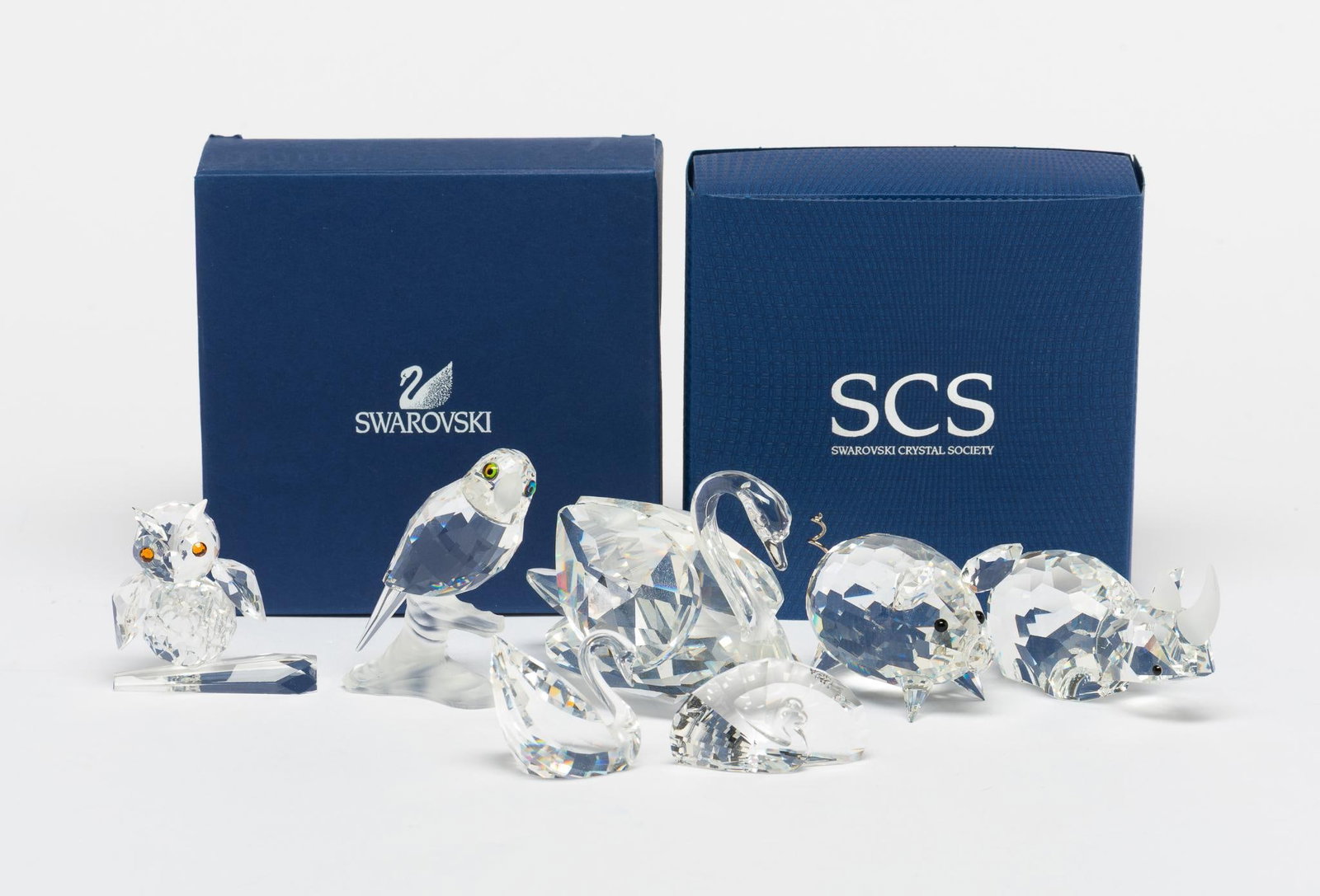8 Swarovski Figurines incl Swans: 1" to 2-1/4" high. 2 Boxes included.