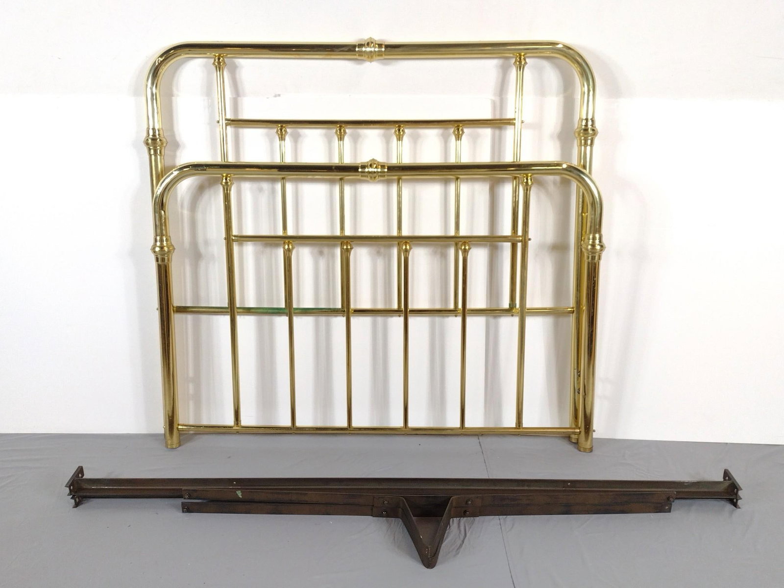 Brass Bed: NOT ELIGIBLE FOR IN-HOUSE SHIPPING. 61" wide X 87" deep X 55-1/2" high. Bed has discoloring and finish loss. PROVENANCE: From the Estate of Yigal Elyadin. Yigal Elyadin was born in 1950 in Tel Aviv, I