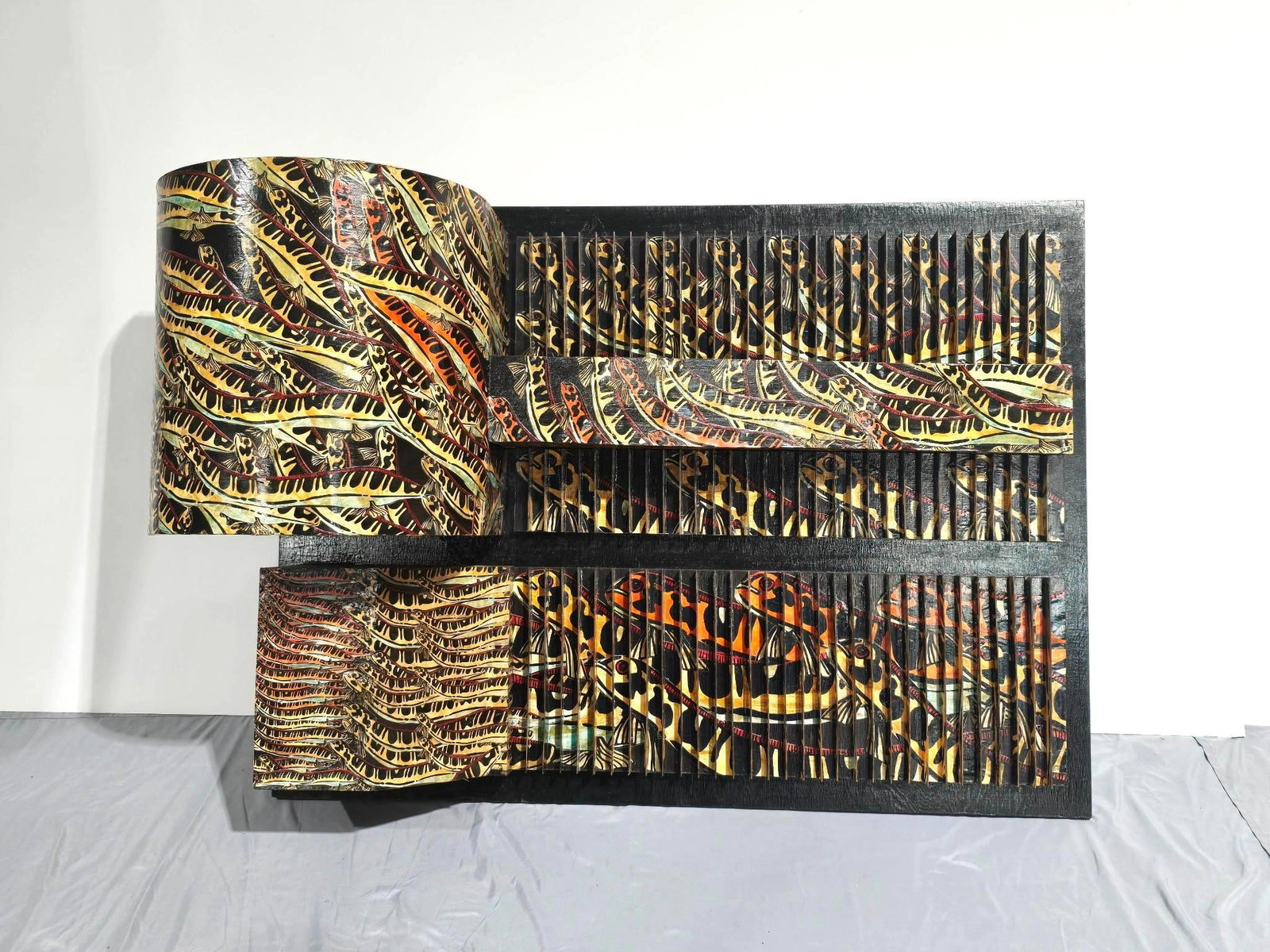 Oversized Yigal Elyadin Wood / Cardboard 3D Wall Transformation: NOT ELIGIBLE FOR IN-HOUSE SHIPPING. Overall 52" wide x 17" deep x 36" high. PROVENANCE: From the Estate of Yigal Elyadin. Yigal Elyadin was born in 1950 in Tel Aviv, Israel and came to the United Stat