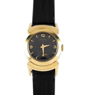 Art Deco Lord Elgin 14K Gold Filled Wrist Watch: A mid-sized watch with Art Deco lugs and numerals on an original black dial adorned with a raised dot golf ball pattern. case diameter not including crown or lugs is 27 mm. The watch sets, runs and ke