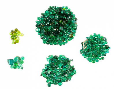Collection of Loose Green Gemstones: Includes peridot, emeralds, doublets, synthetic, and glass.
