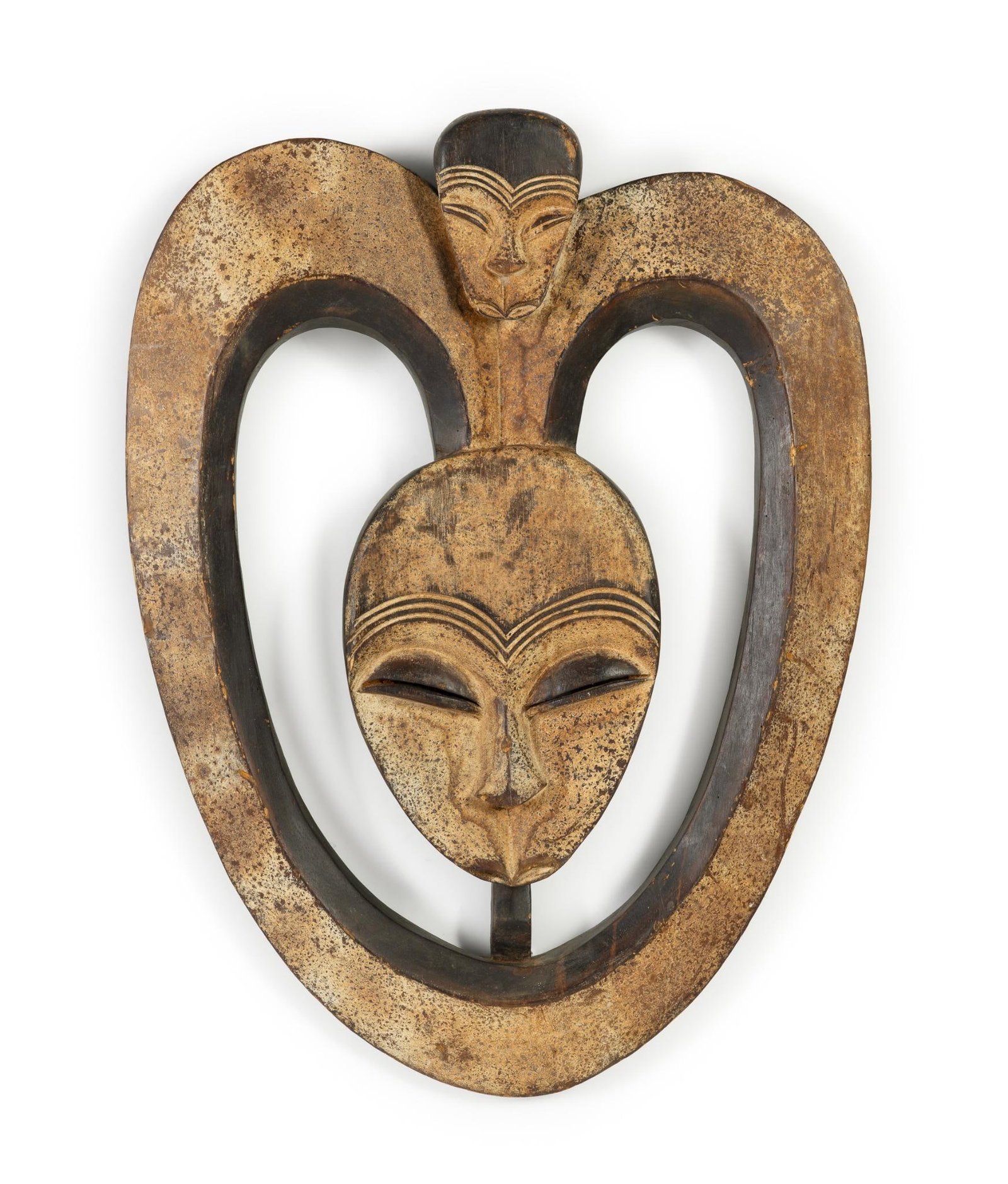 Kwele Mask: NOT ELIGIBLE FOR IN-HOUSE SHIPPING. The Kwele, are a tribal group residing in the forest region of Gabon, Cameroon, and the Republic of Congo. They are part of the Bantu linguistic group and are known