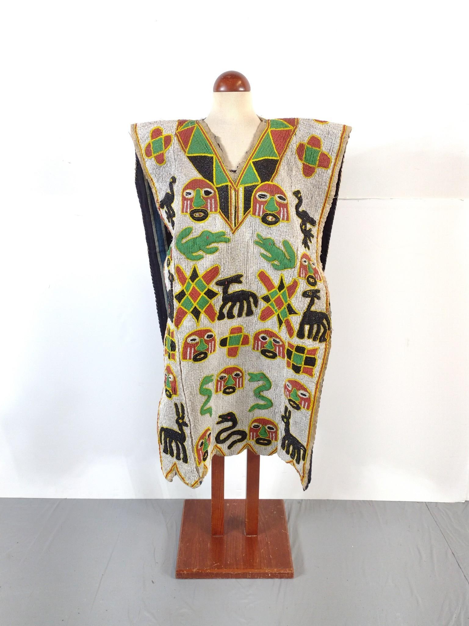 Yoruba Beaded Tunic: The Yoruba are a West African ethnic group primarily residing in Nigeria and Benin, with a global population exceeding 50 million. They are known for their distinct language, cultural traditions and h