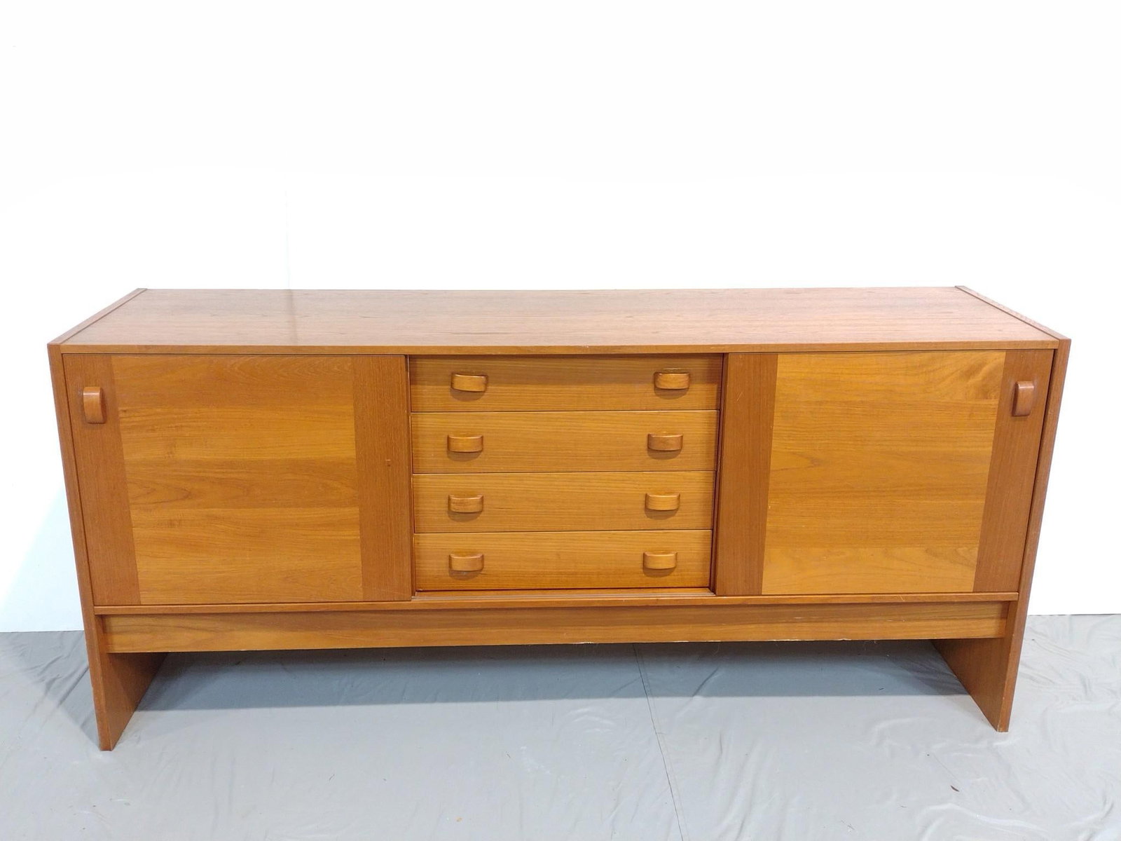 Domino Mobler Modern Sideboard: NOT ELIGIBLE FOR IN-HOUSE SHIPPING. 72-1/2" wide X 19-1/2" deep X 32-1/2" high. Has some light scratches. One leg has repair to veneer.