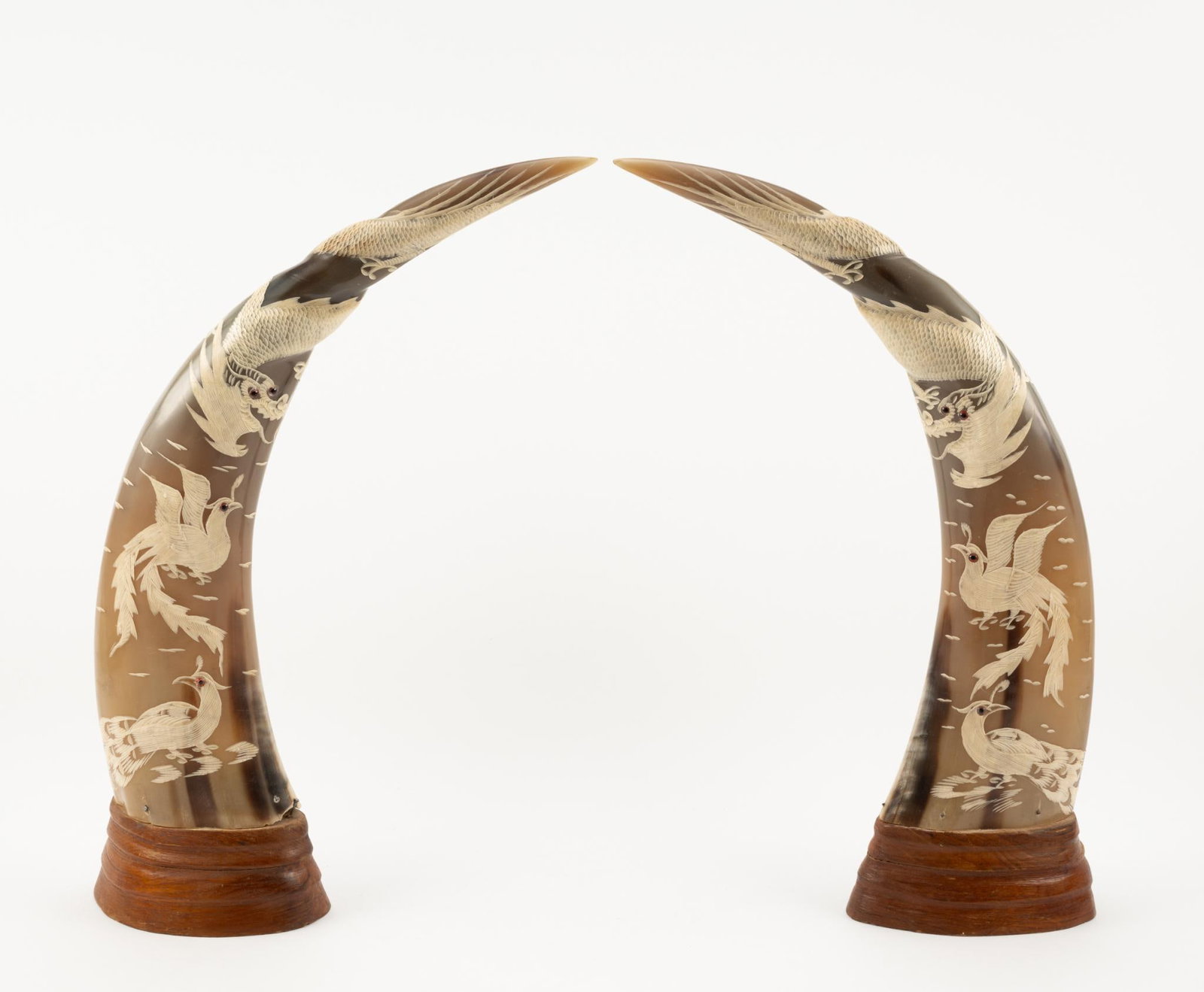 2 Etched Horns: Etched with dragons and birds. Each approximately 13" wide x 19" high. Some losses where horn meets wood base.