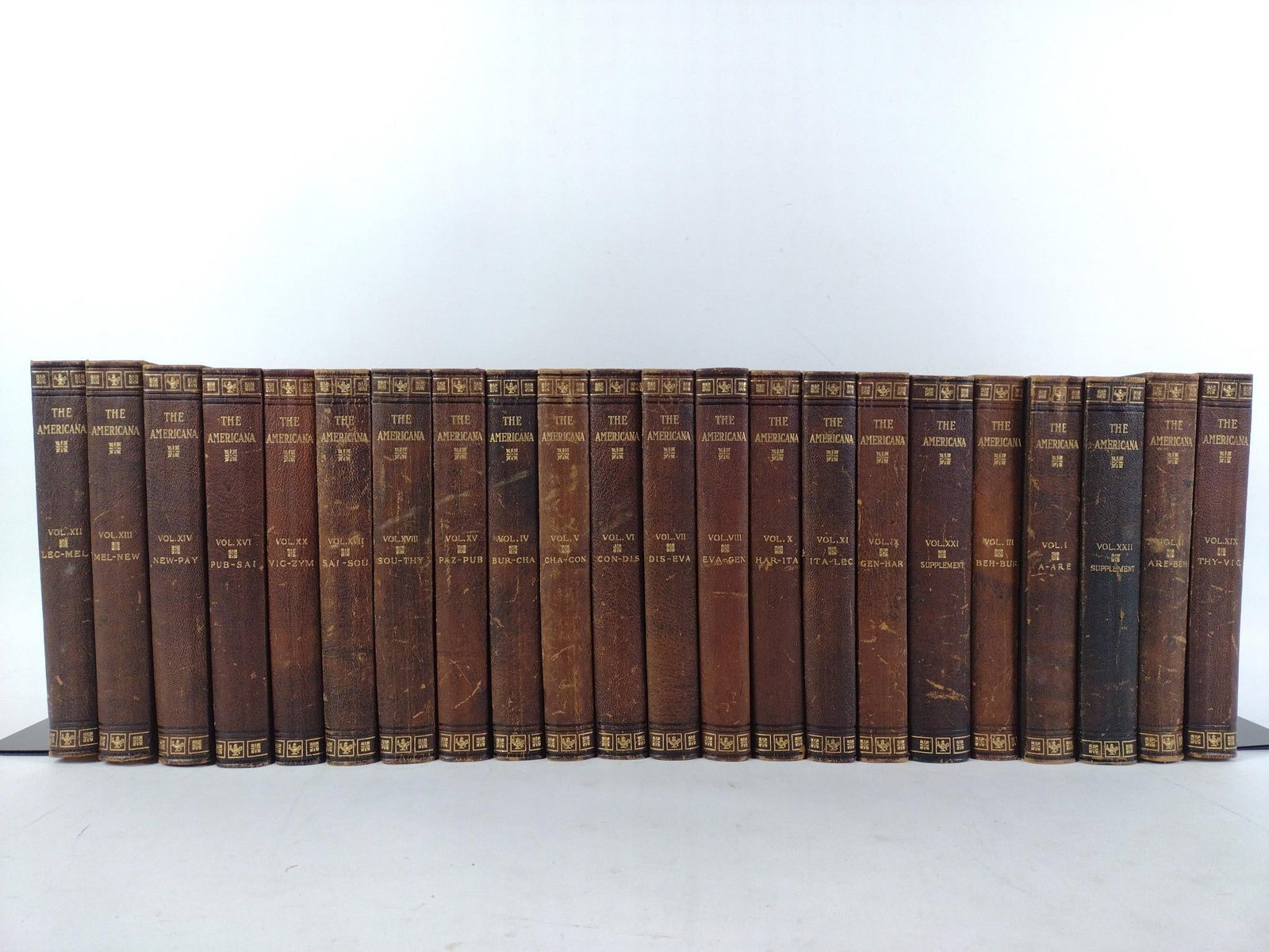22 Volumes The Americana: NOT ELIGIBLE FOR IN-HOUSE SHIPPING. Published by Scientific American Compiling Dept in 1911. In good condition slight wear to spines.