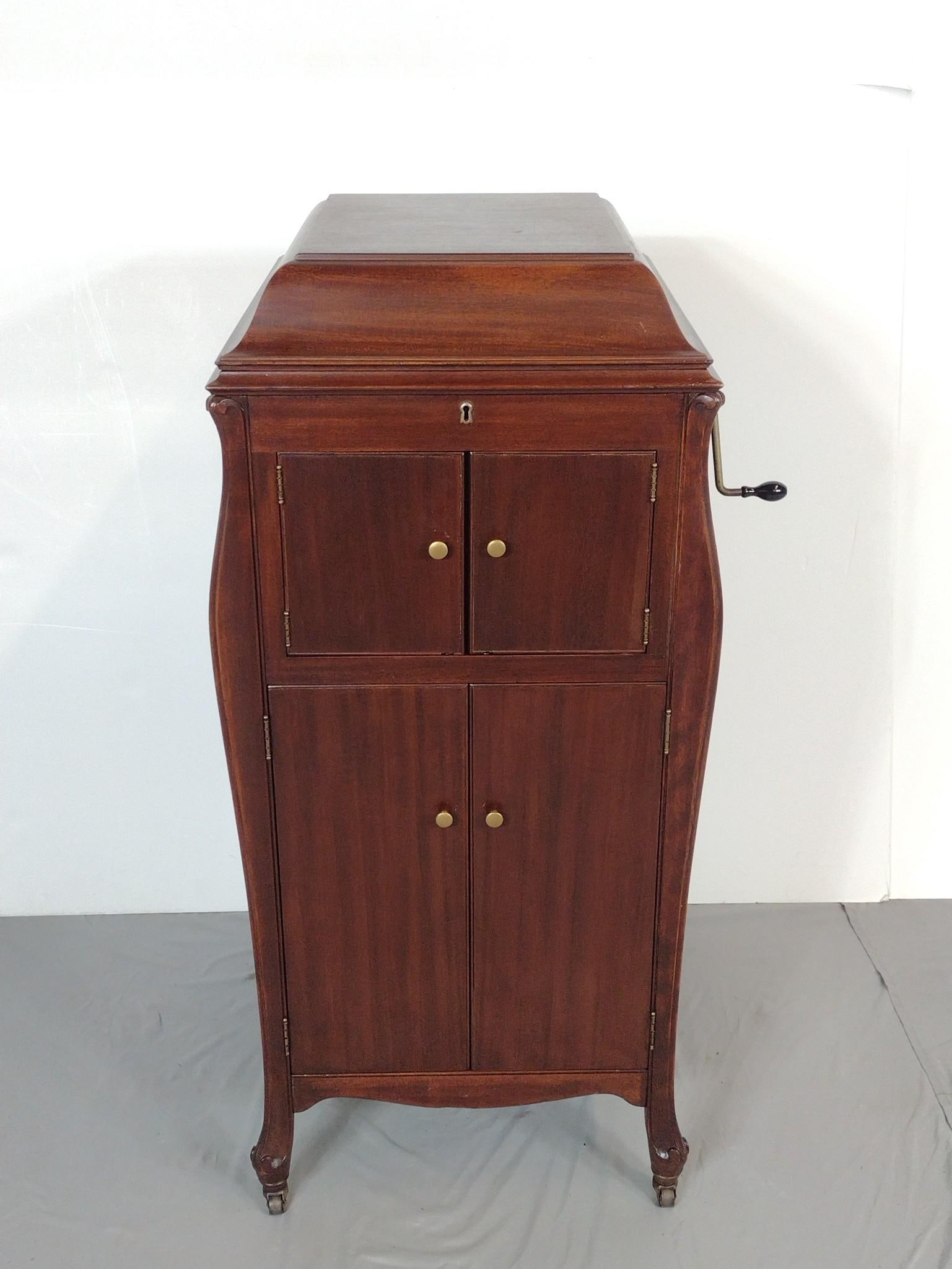Victrola XI Record Player: NOT ELIGIBLE FOR IN-HOUSE SHIPPING. 19" wide X 22" deep X 43-1/2" high. Working.