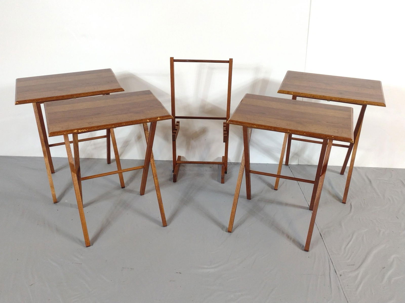 Set a of TV Trays: NOT ELIGIBLE FOR IN-HOUSE SHIPPING. Each 21" wide X 15" deep X 25" high. All have scratches and finish loss