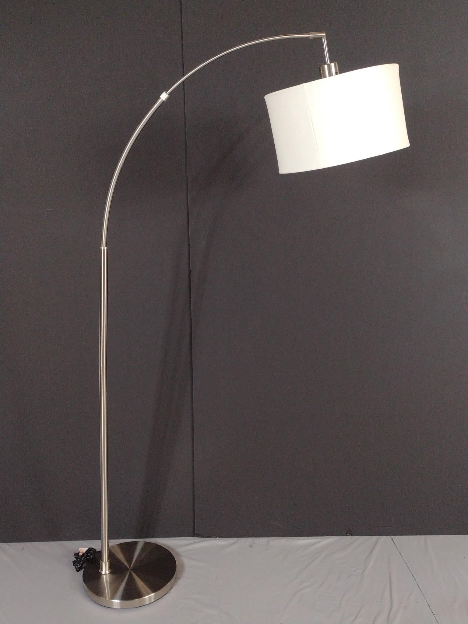 Modern Brushed Metal Arc Floor Lamp: NOT ELIGIBLE FOR IN-HOUSE SHIPPING. 45" wide X 12-1/2" deep X 68" high. Has a few light scratches.