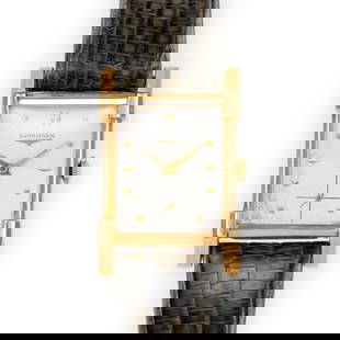 Antique Rectangular Longines Wrist Watch 14K Gold: A Longines from 1951 with a machine patterned dial that changes tone top half/bottom half at light angles. Dial is original and shows some aging. The watch is on a genuine alligator lizard Omega band.