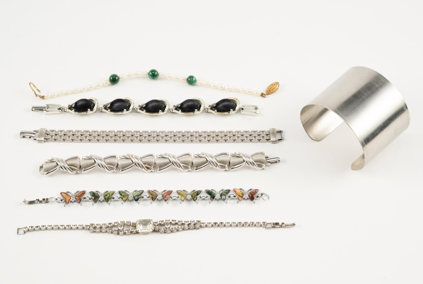 7 Costume Bracelets: Cuff measures 2-1/2" inside diameter x 2" wide. Measure 5-1/2" to 6-3/4" long.