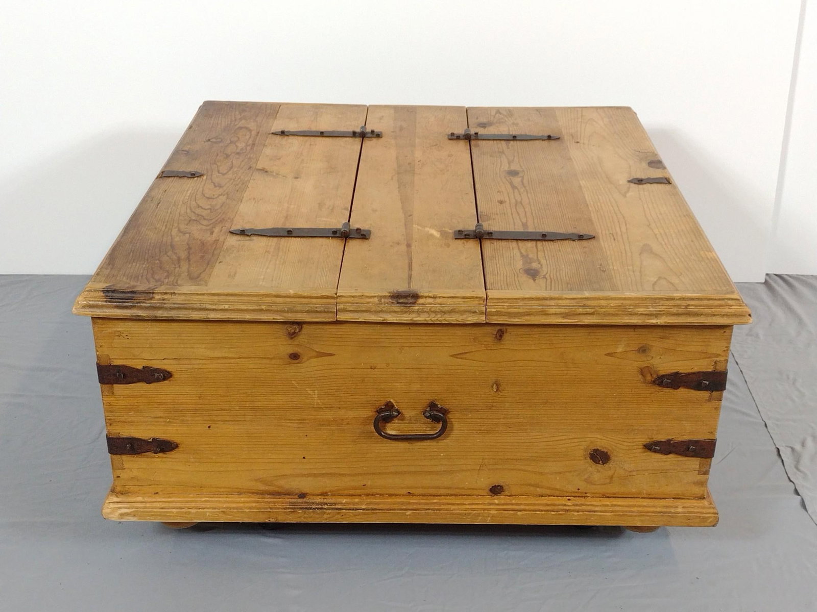 Chest Coffee Table On Wheels: NOT ELIGIBLE FOR IN-HOUSE SHIPPING. 35-1/2" wide X 35-1/2" deep X 18-1/2" high. Has some scratches.