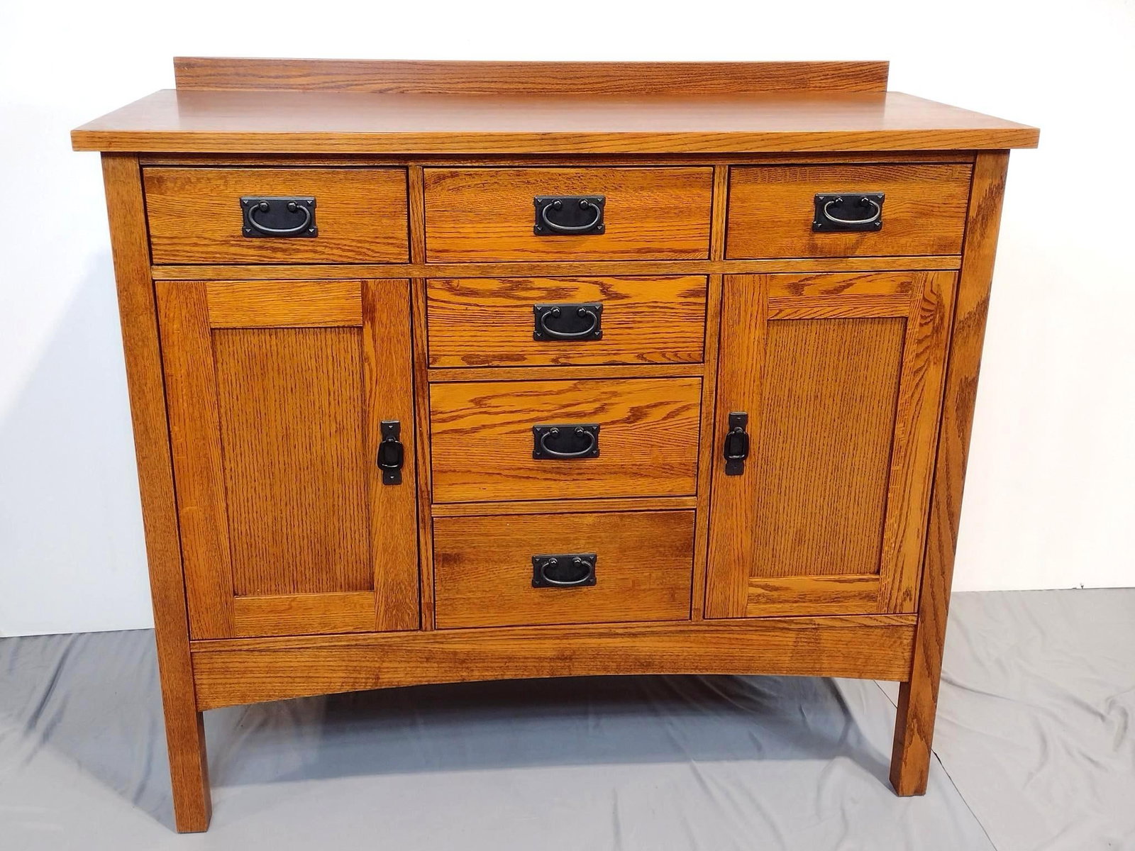 CF Kent Co Mission Style Server: NOT ELIGIBLE FOR IN-HOUSE SHIPPING. Sturdy / heavy. 48" wide X 21" deep X 43-1/2" high. Small amount of grey paint to back left corner.