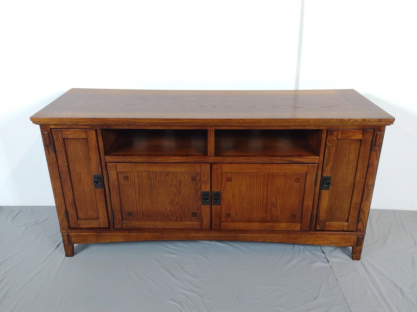 TV Stand: NOT ELIGIBLE FOR IN-HOUSE SHIPPING. 60" wide X 20" deep X 29-1/2" high. No manufactures name found.