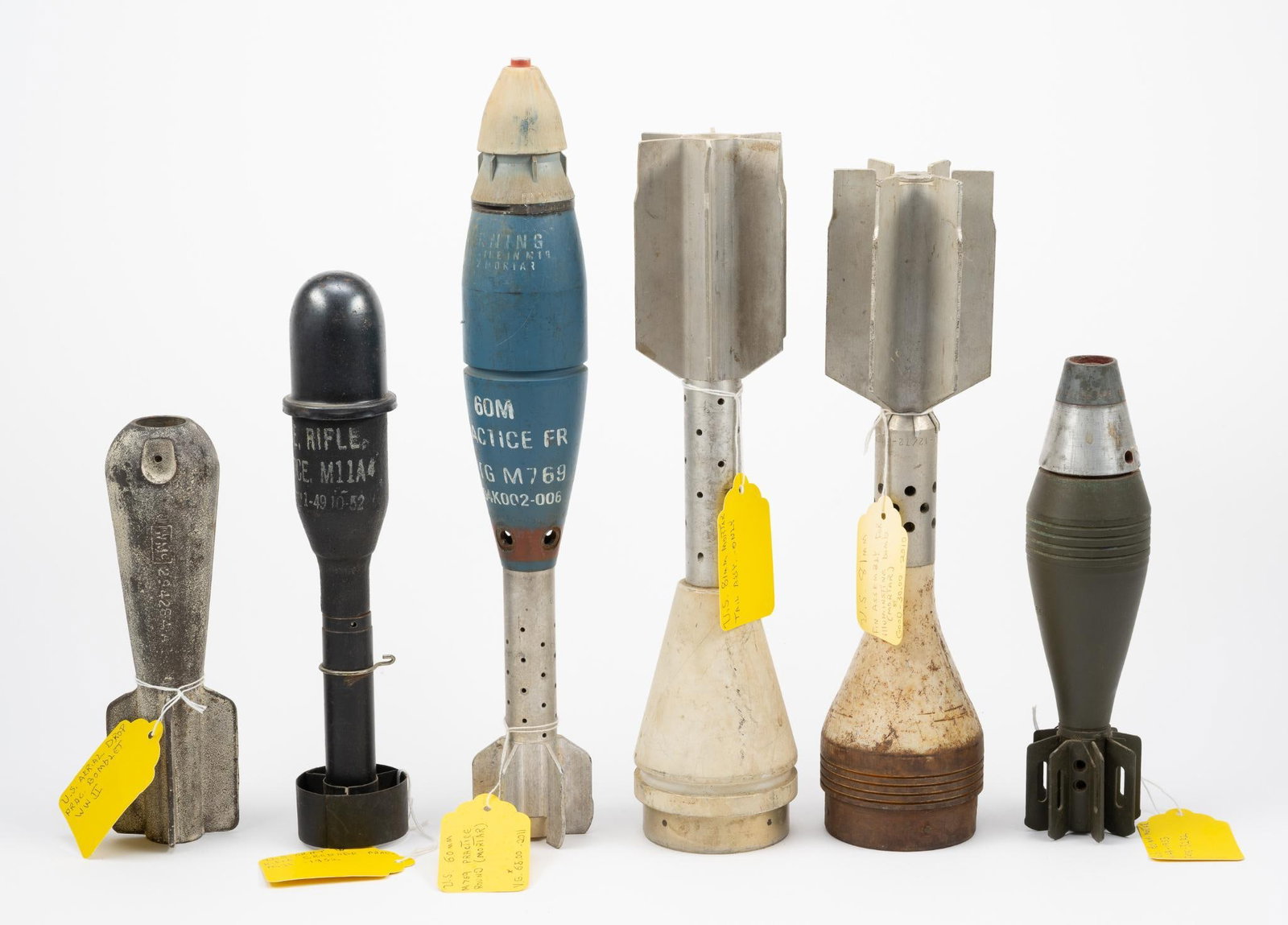 6 Mortars & Bomblet: NOT ELIGIBLE FOR IN-HOUSE SHIPPING. Includes U.S. 81mm fin assembly for illuminating bomb; U.S. 60mm M769 practice round; U.S. 81mm mortar tail assembly only; U.S. 50mm mortar M49-1953 Fuse-52A2; U.S.