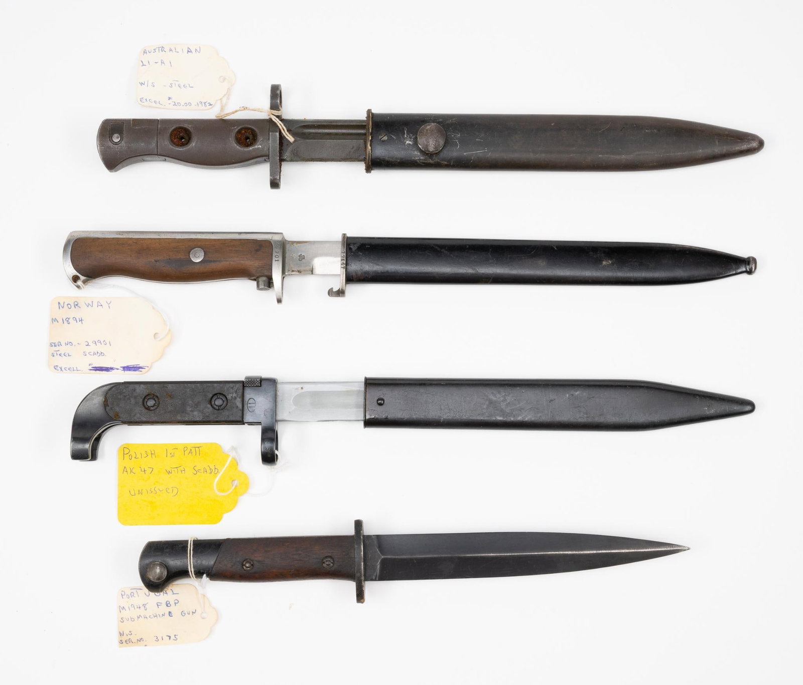 4 Bayonets: NOT ELIGIBLE FOR IN-HOUSE SHIPPING OUTSIDE THE UNITED STATES. (1) Portugal M1948 FBP submachine gun serial no 3175 no scabbard. (2) Australian L1-A1 with steel scabbard. (3) Norway M1894 with steel sc