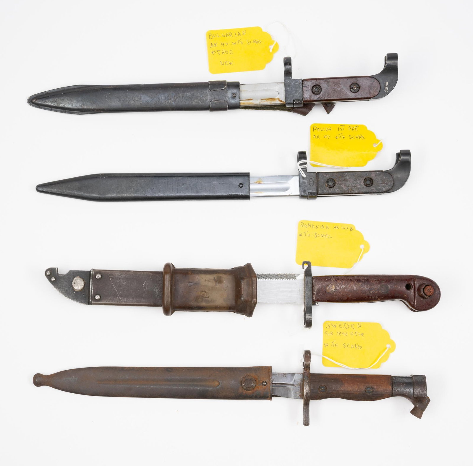4 Bayonets: NOT ELIGIBLE FOR IN-HOUSE SHIPPING OUTSIDE THE UNITED STATES. (1) Swedish Bayonet for 1896 rifle with scabbard. (2) Polish 1st patt AK47 with scabbard. Hilt marked 1958. (3) Romanian AK47B with scabba