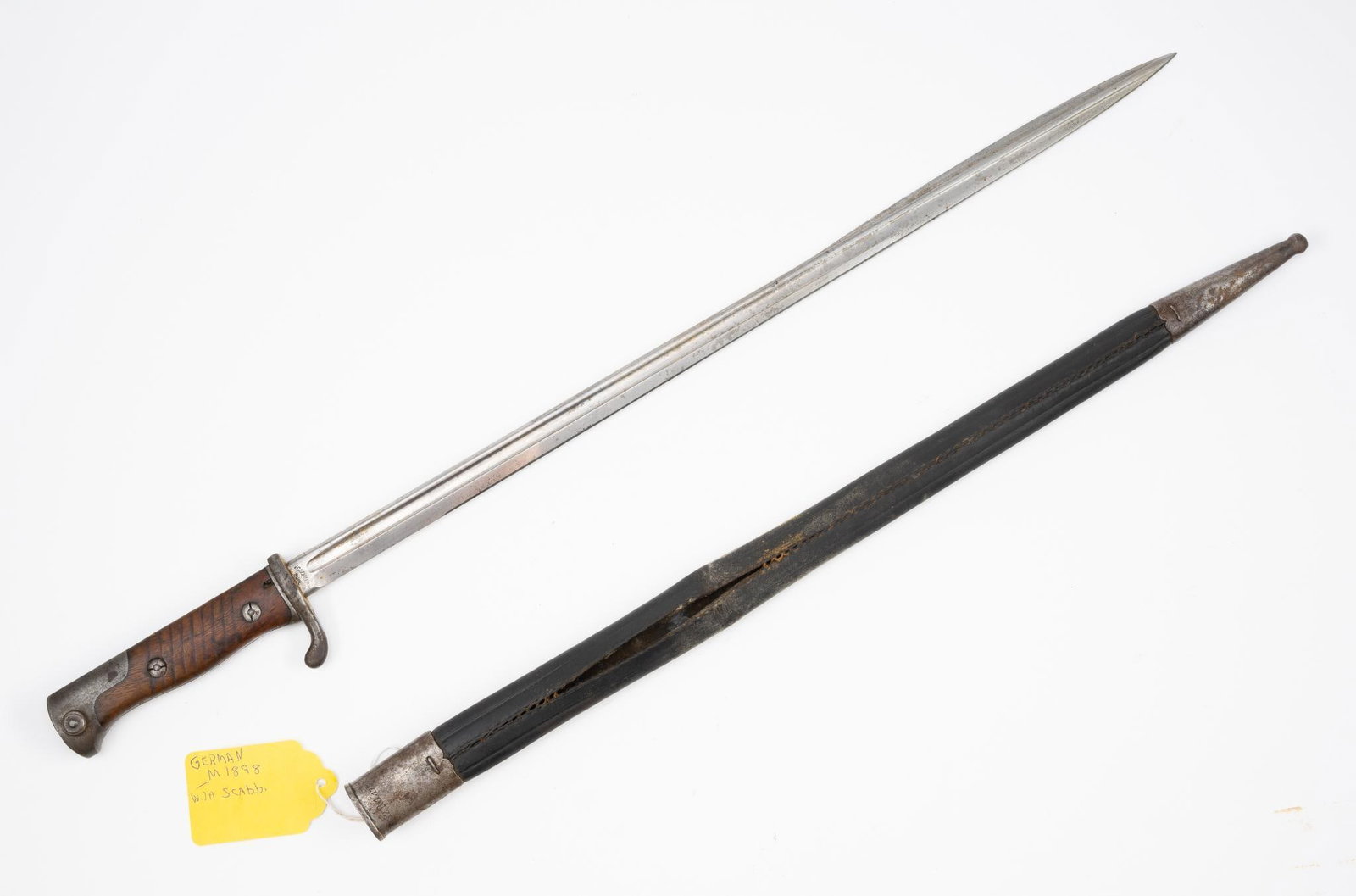 German M1898 Bayonet: NOT ELIGIBLE FOR IN-HOUSE SHIPPING OUTSIDE THE UNITED STATES. With scabbard. Blade marked V.C Schillin Suhl. Scabbard marked 132 R.1.175. 27-1/4" long.