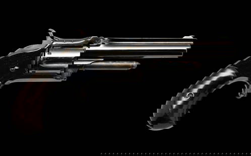 Smith & Wesson Model 1 1/2 Second Issue Single Action Revolver, Caliber .32 RF Long: Serial Number: 33176 Design: The S&amp;W Model 1 1/2 Second Issue revolver was manufactured between 1868 and 1875. This example has a 3 1/2" barrel with bright bore, a 5-shot cylinder and rosewood gri