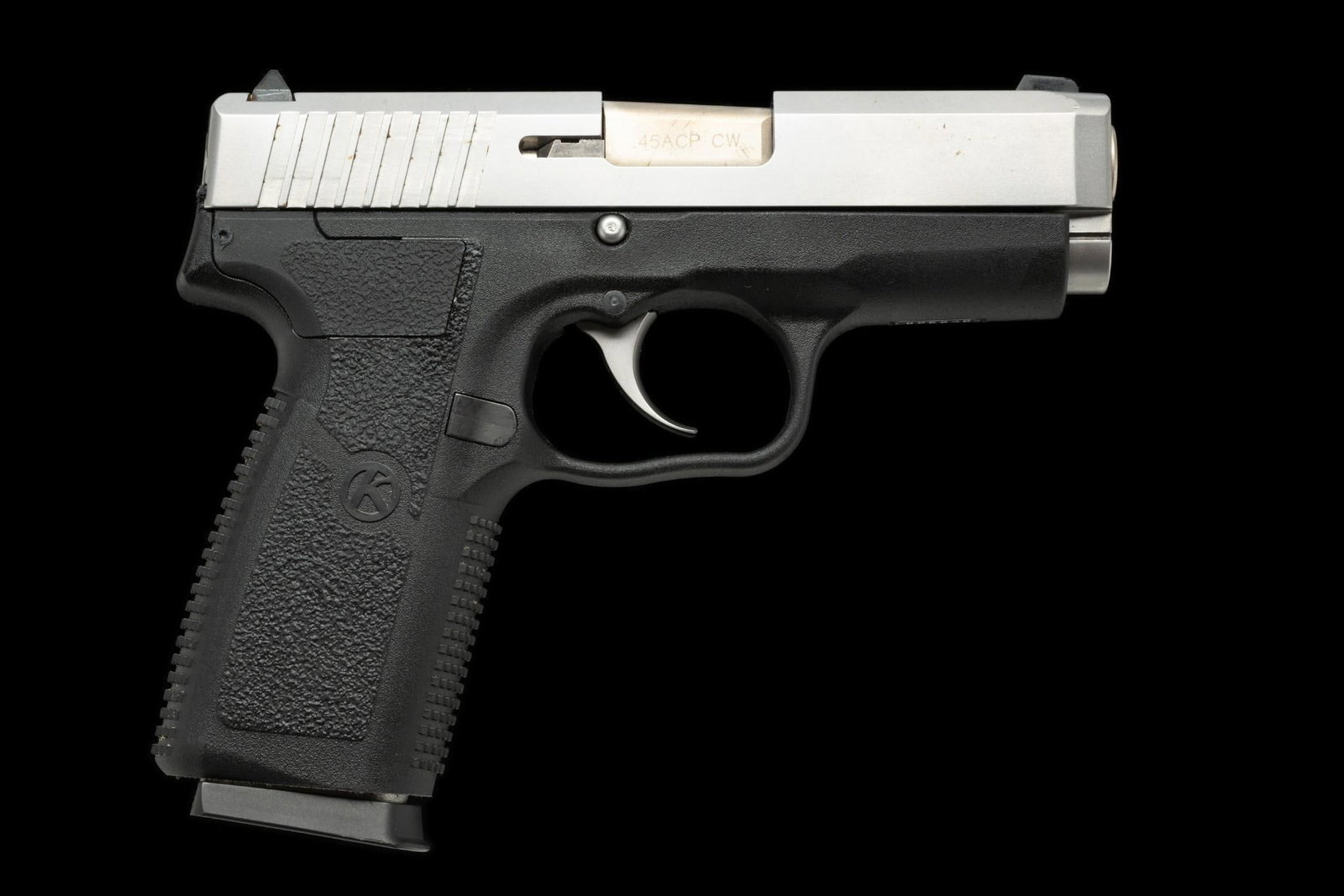 Kahr Arms CW45 Semi Auto Pistol, Caliber .45ACP: Serial Number: SE6958 Design: The Kahr Arms CW45 is a compact semi automatic pistol with a black polymer frame and a stainless steel slide. Overall length is 6 1/2" and the barrel is 3 1/2" in length.