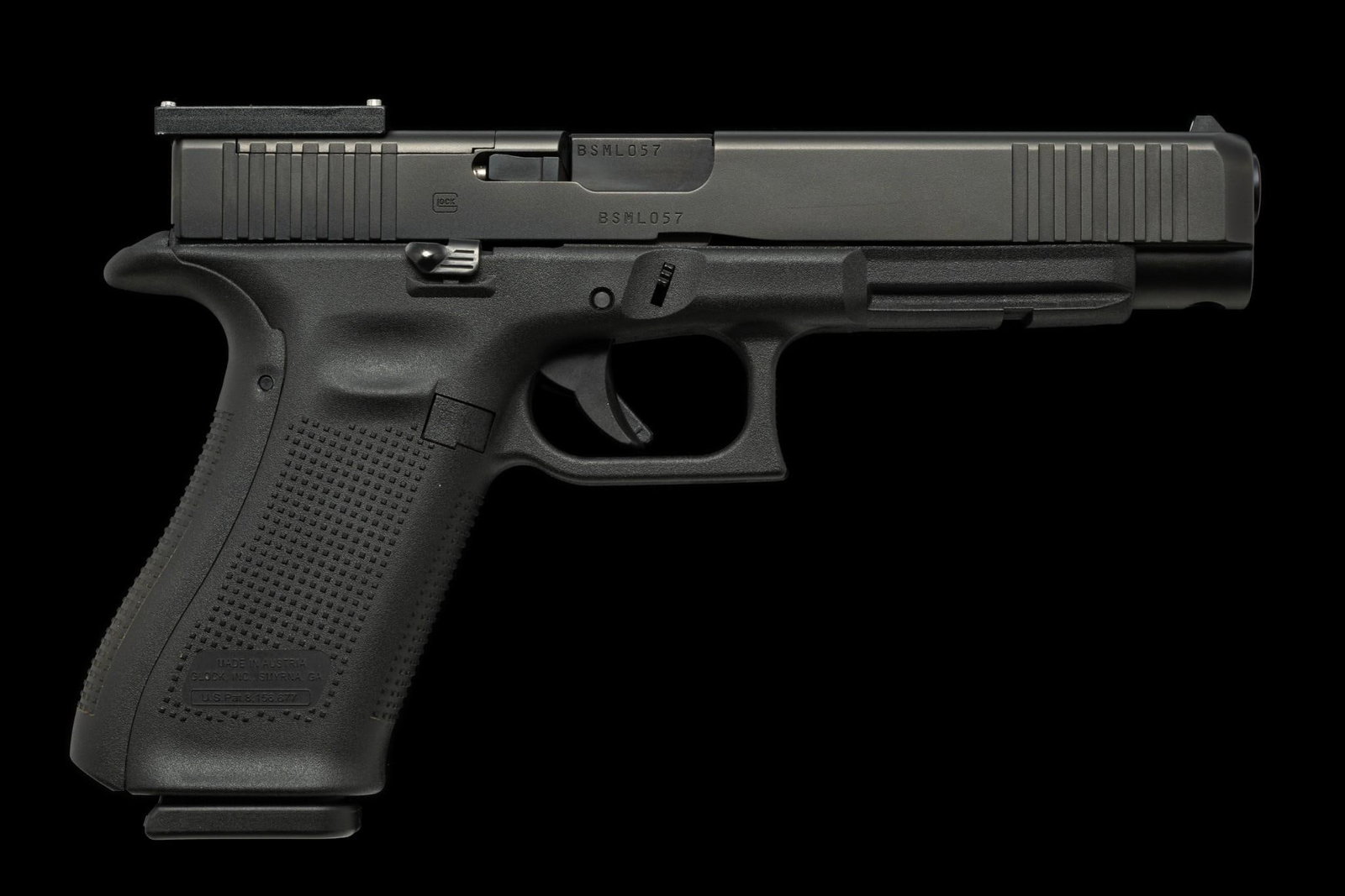 Glock 34 Semi Auto Pistol w/ Optics, Caliber 9mm Luger: Serial Number: BSML057 Design: This Glock 34 is a Gen 5 variant with long slide and a 5 1/4" barrel. Caliber 9mm Luger. No conventional rear sight. Rather, the piece is optics ready and a Glock D1 pla